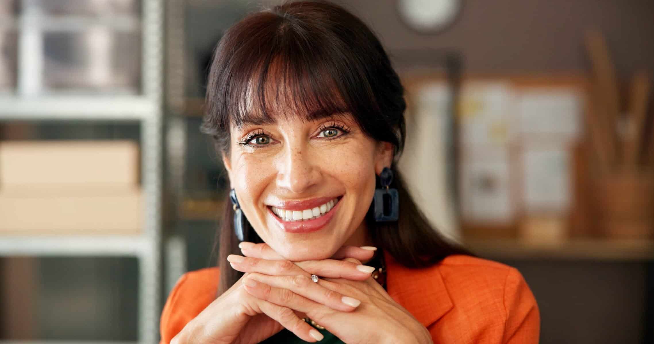 A confident middle aged woman in her office.
