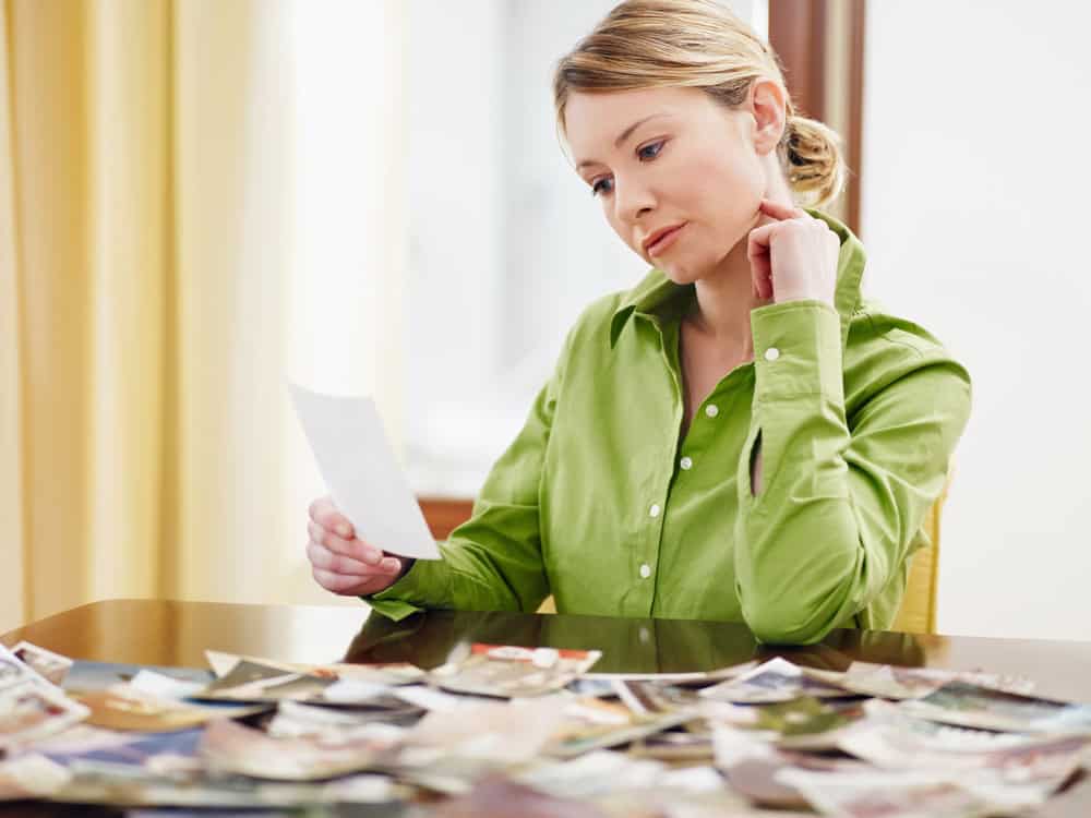 A woman looking at pictures