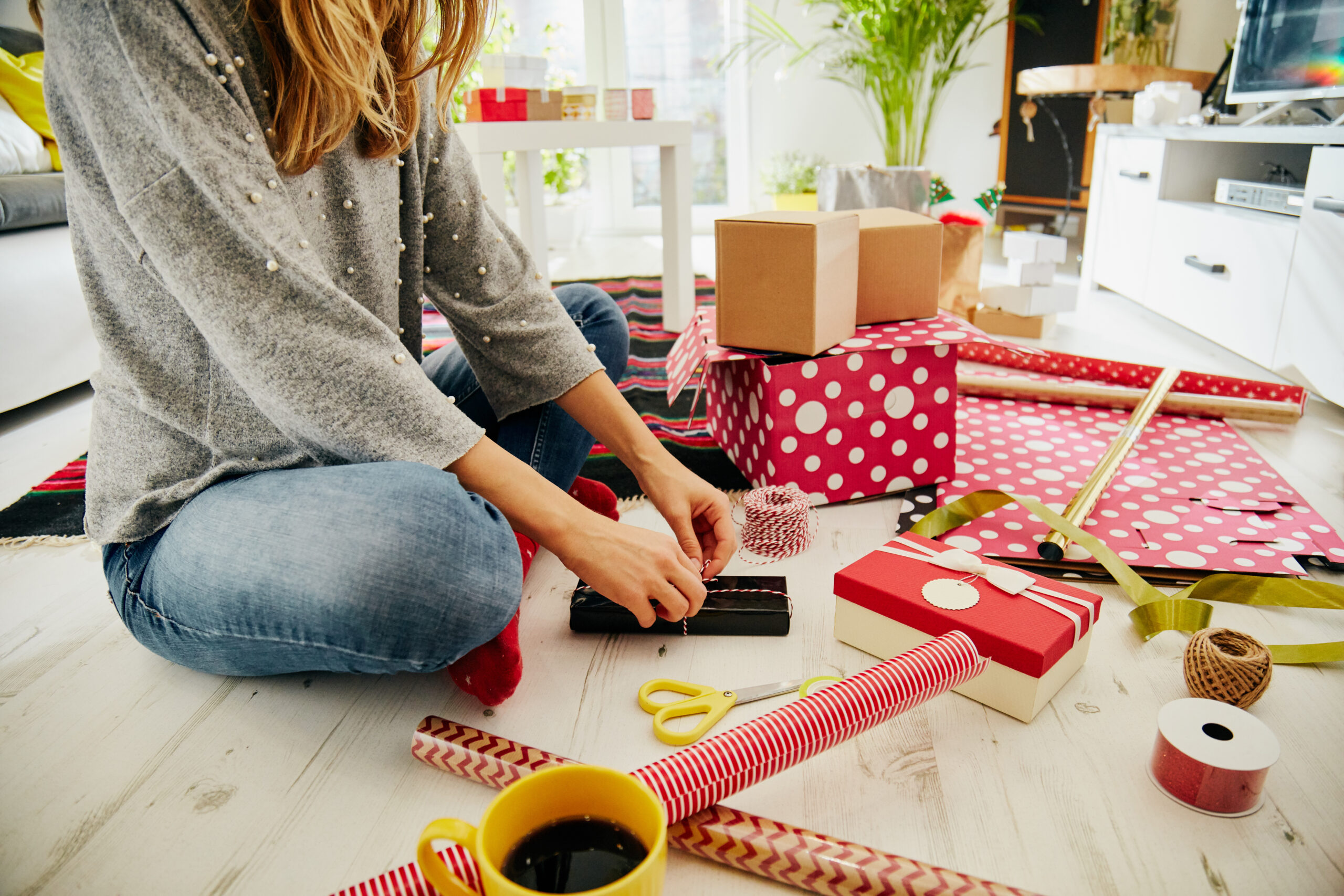 A woman preparing gifts for family and friends.