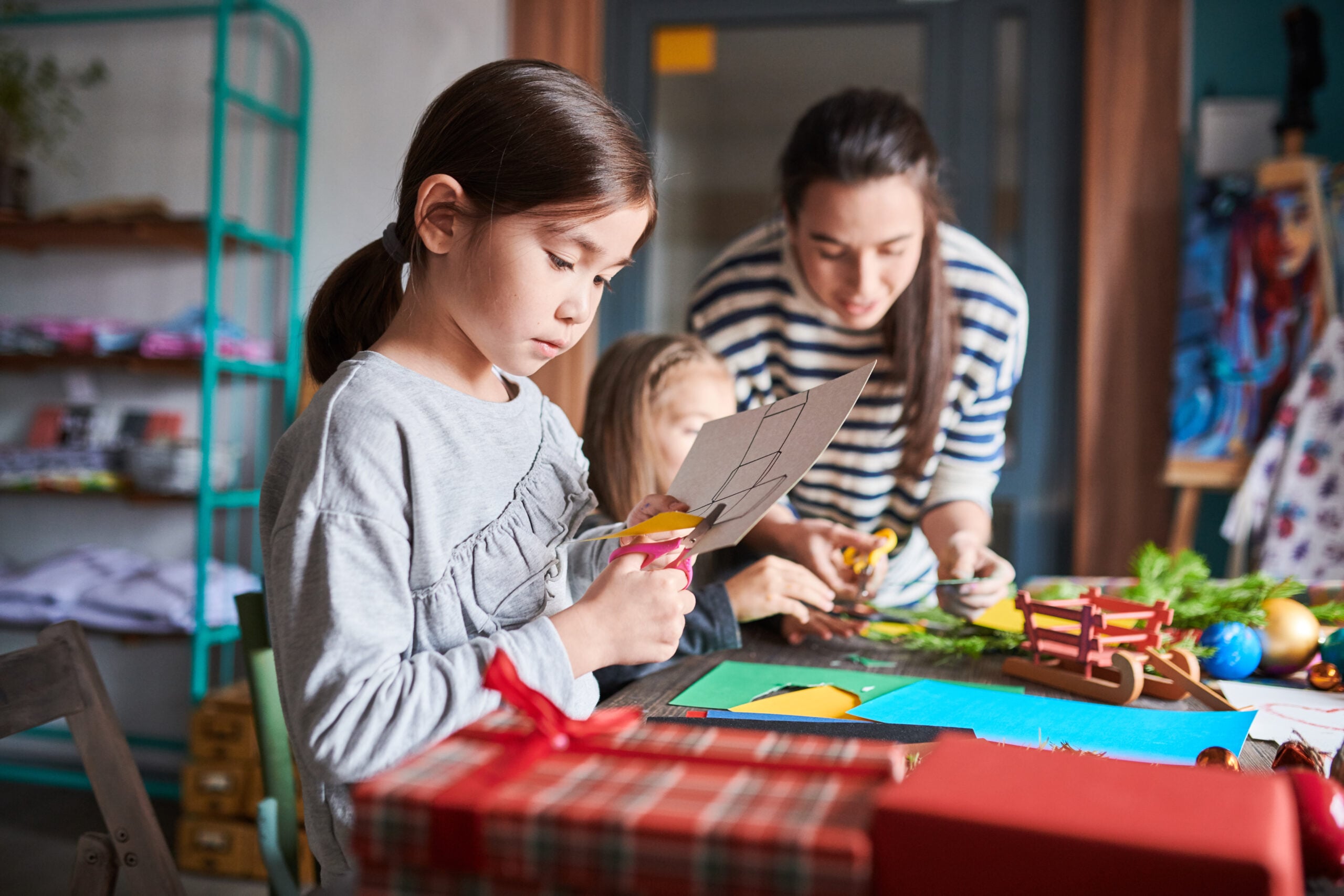 Children making homemade gifts in art class.
