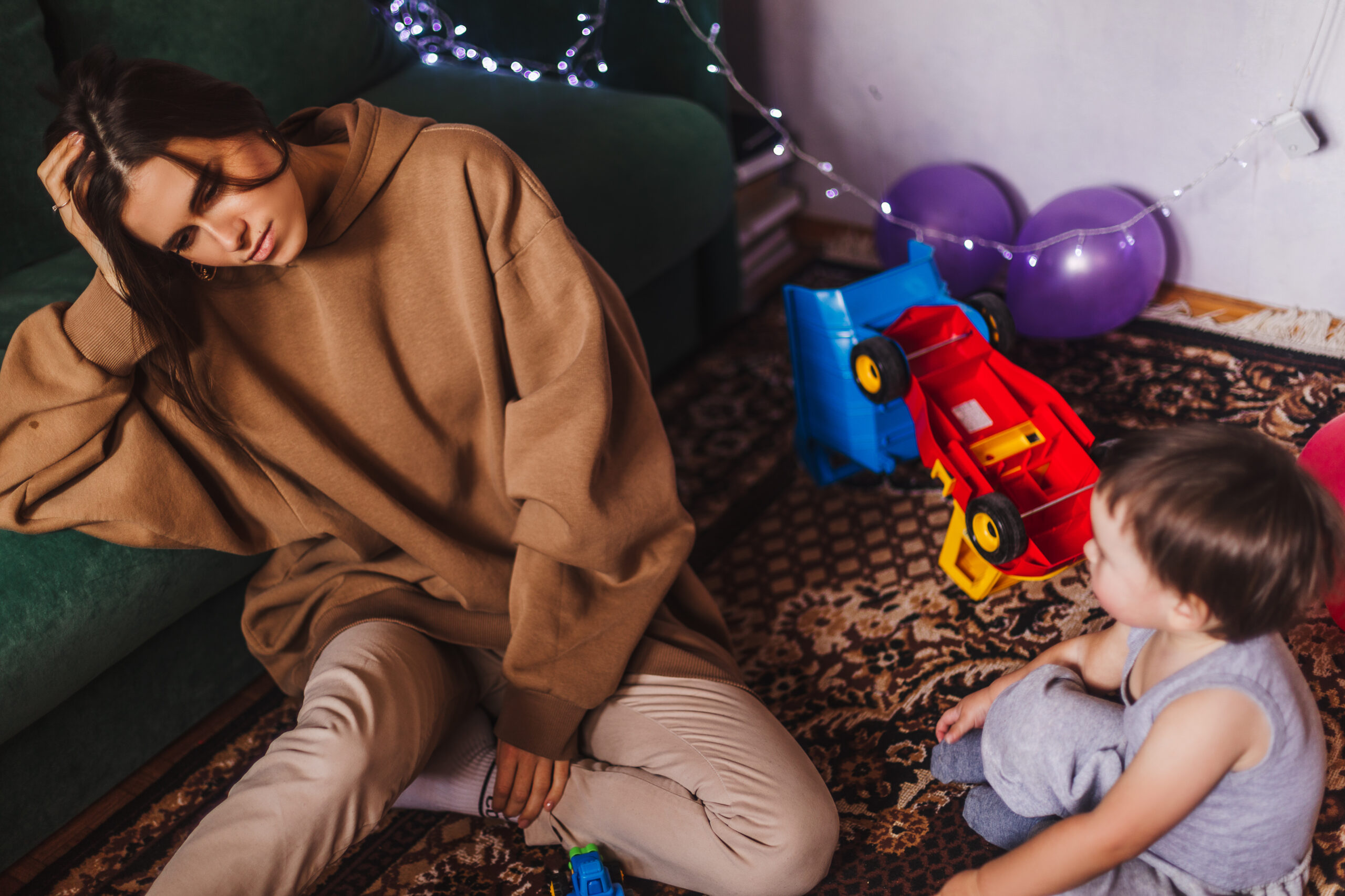 A tired mother at a family party.