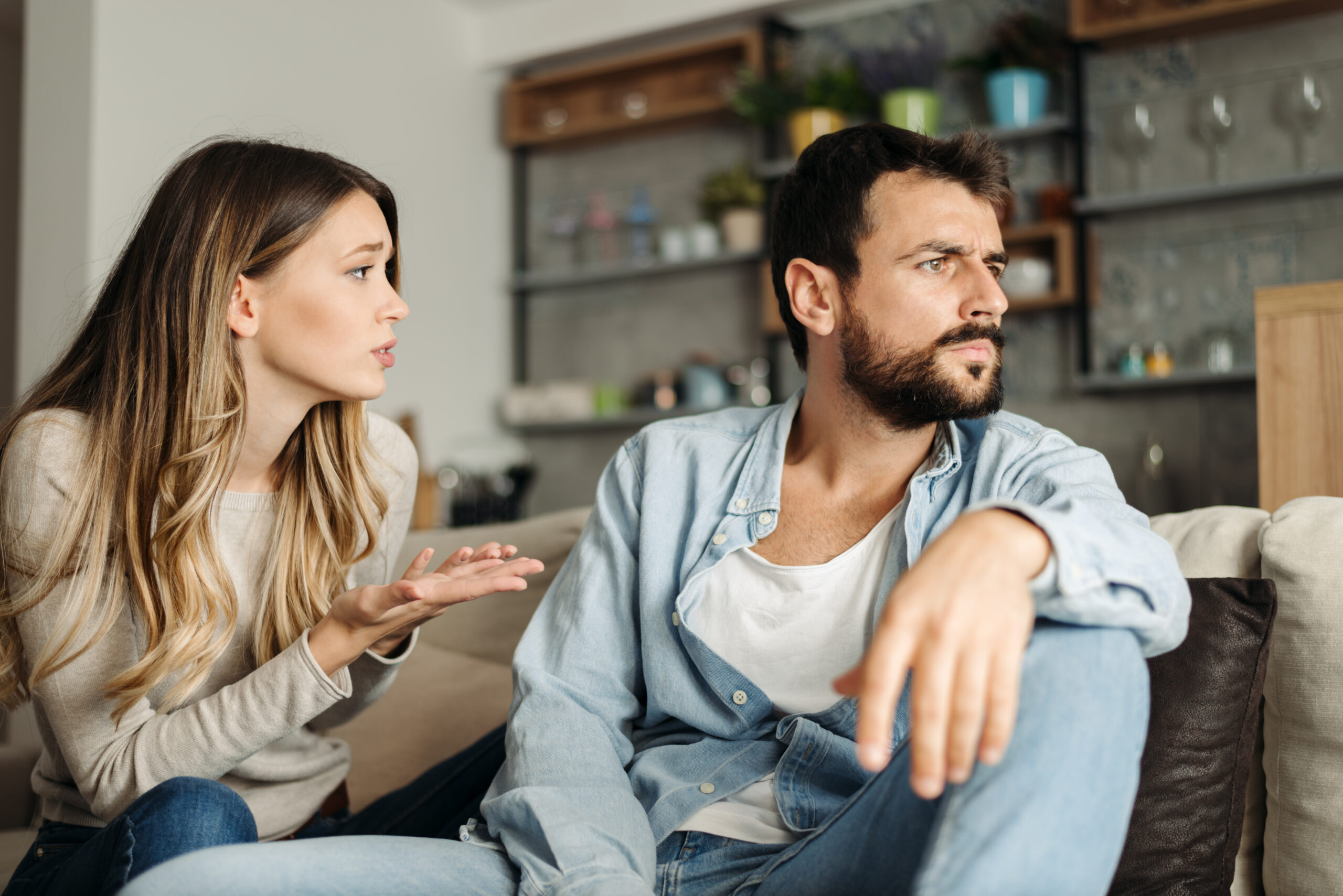 A married couple trying to work through a disagreement.