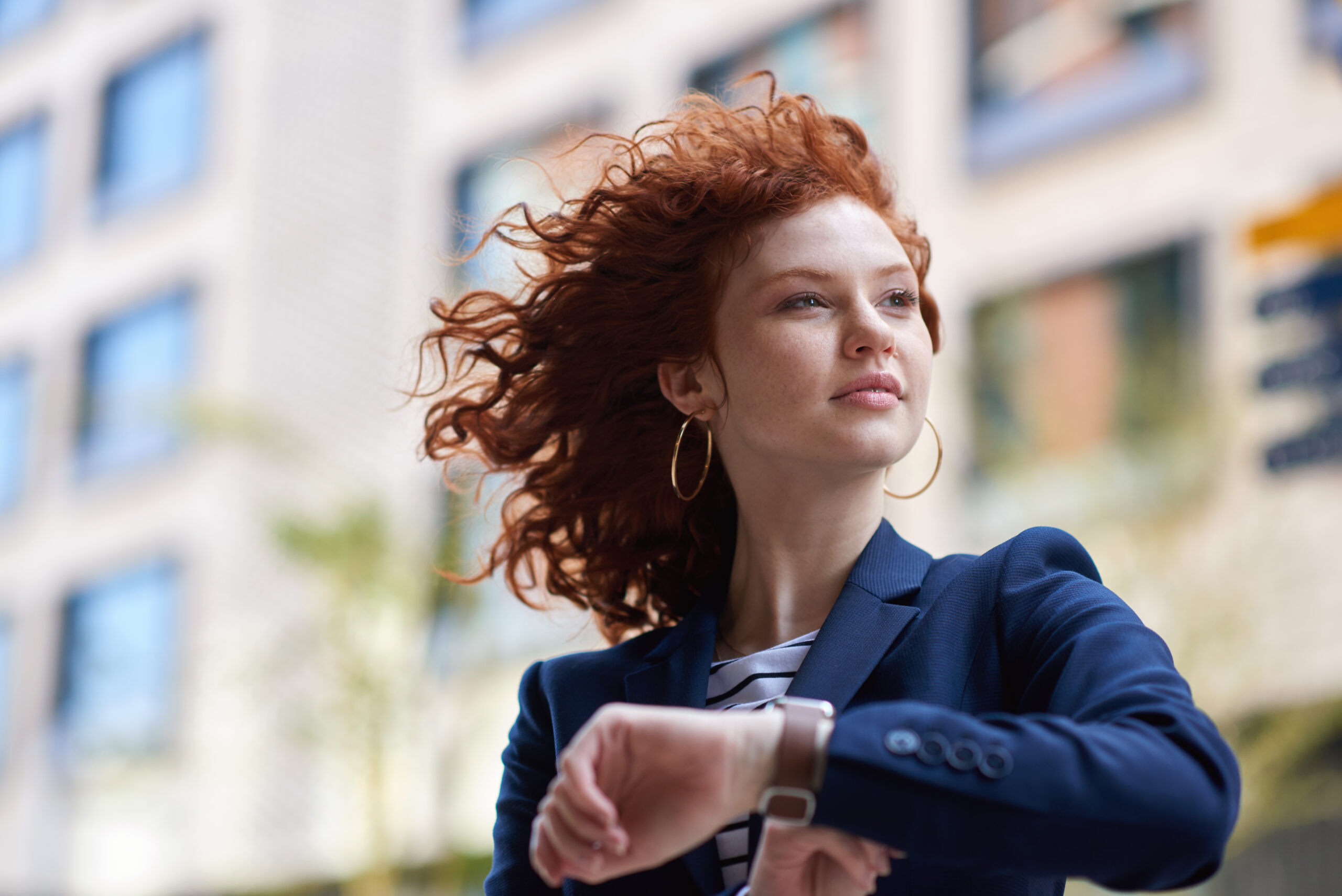 A confident businesswoman on her way to a meeting.