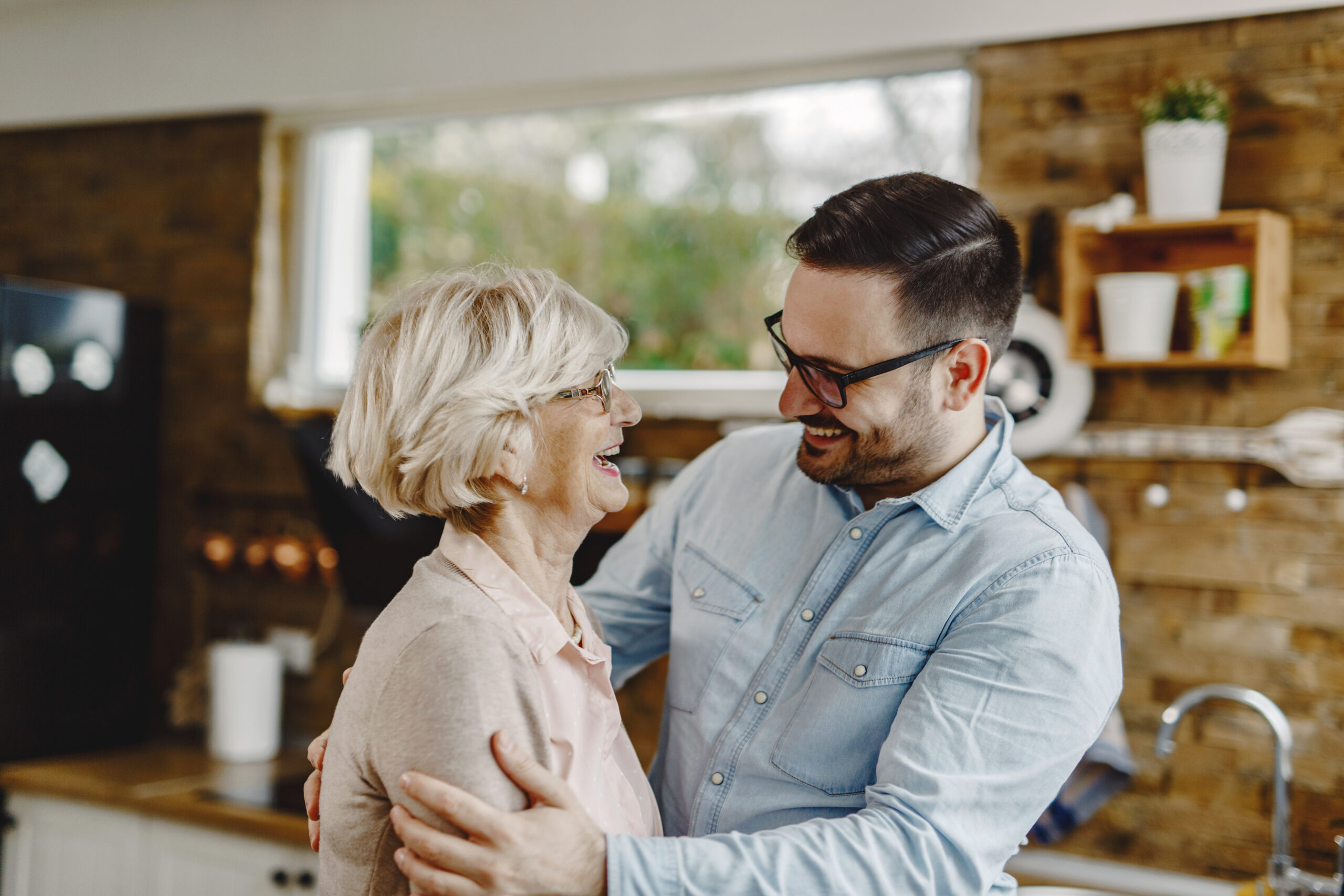 An adult son reminiscing with his mother.