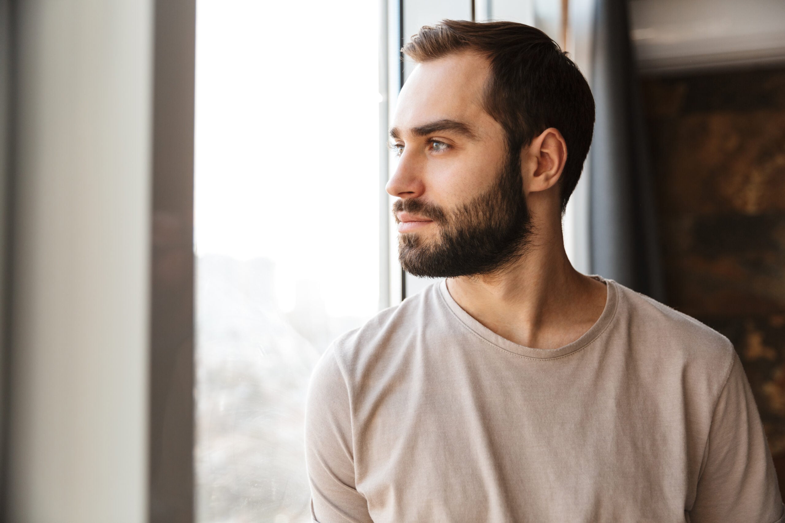 A man standing alone deep in thought.