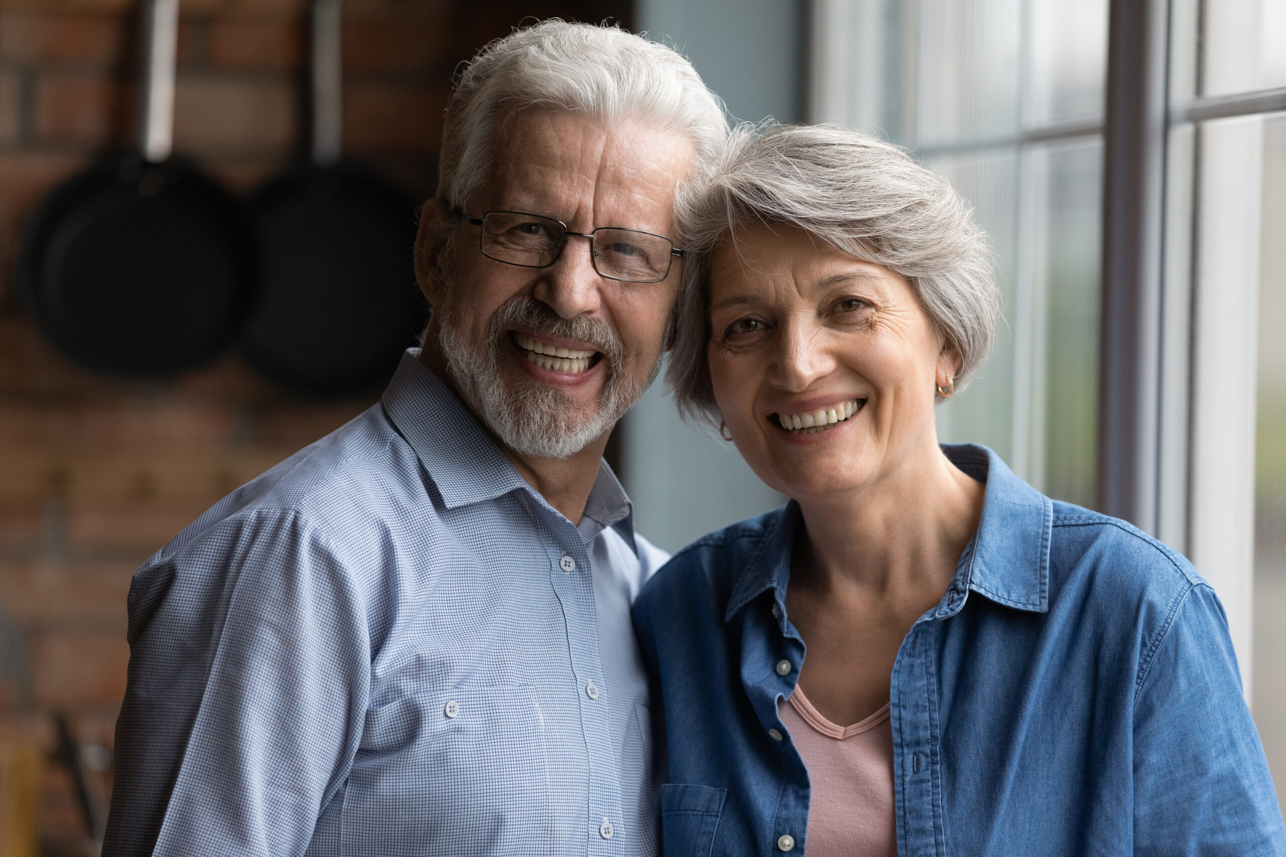 Elderly parents smiling.