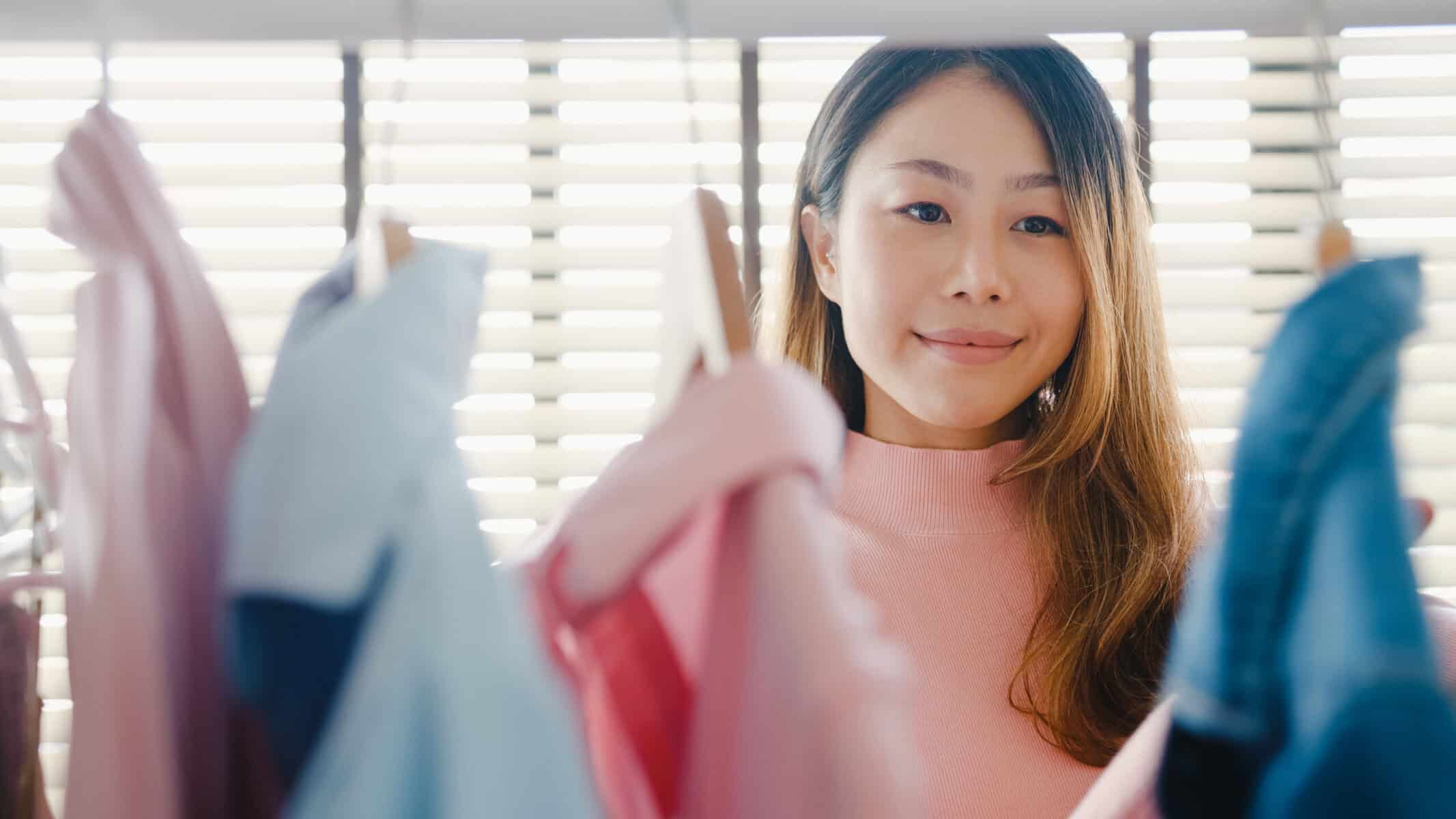 A woman in her closet choosing her outfit for the day.