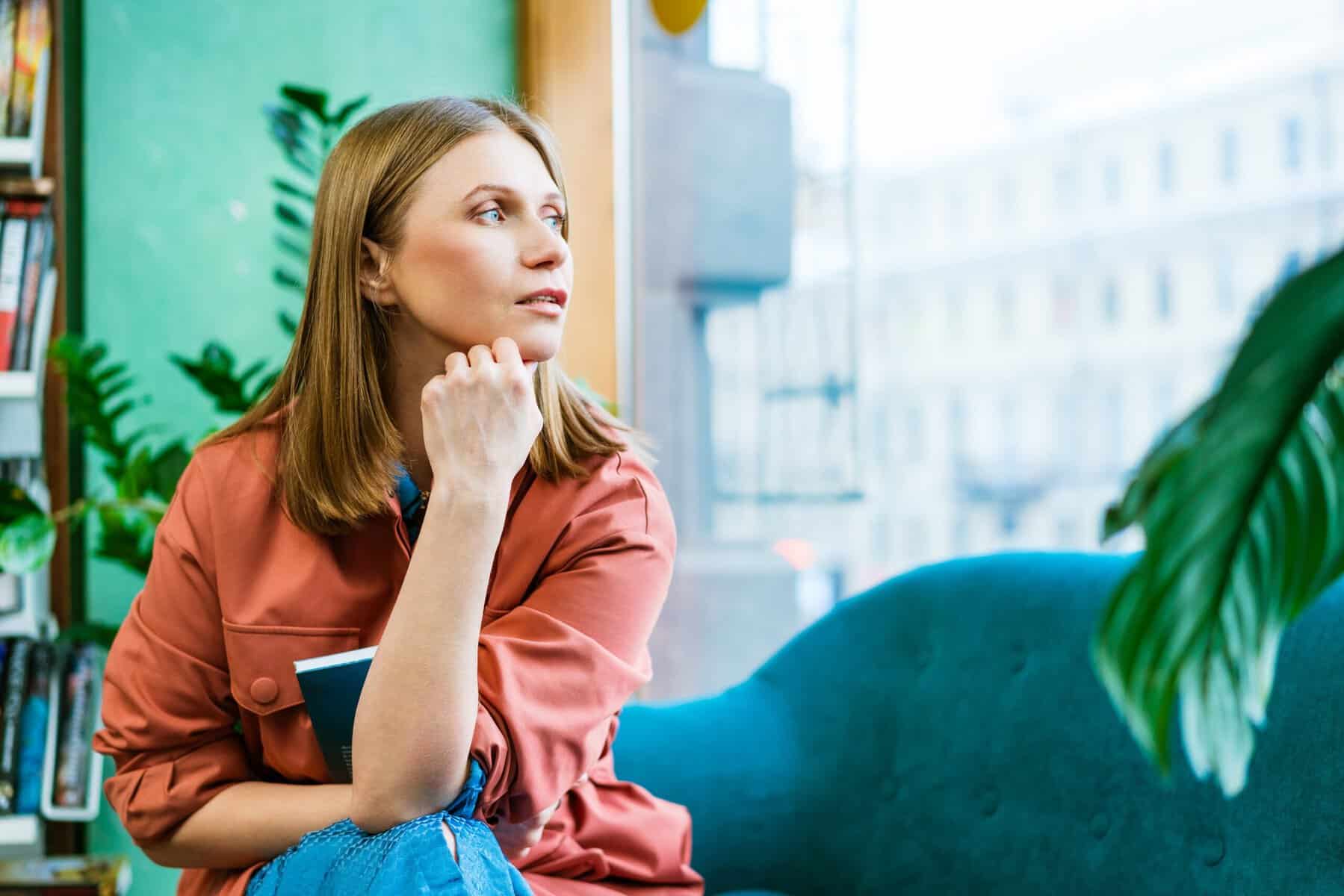 A woman sitting alone deep in thought.
