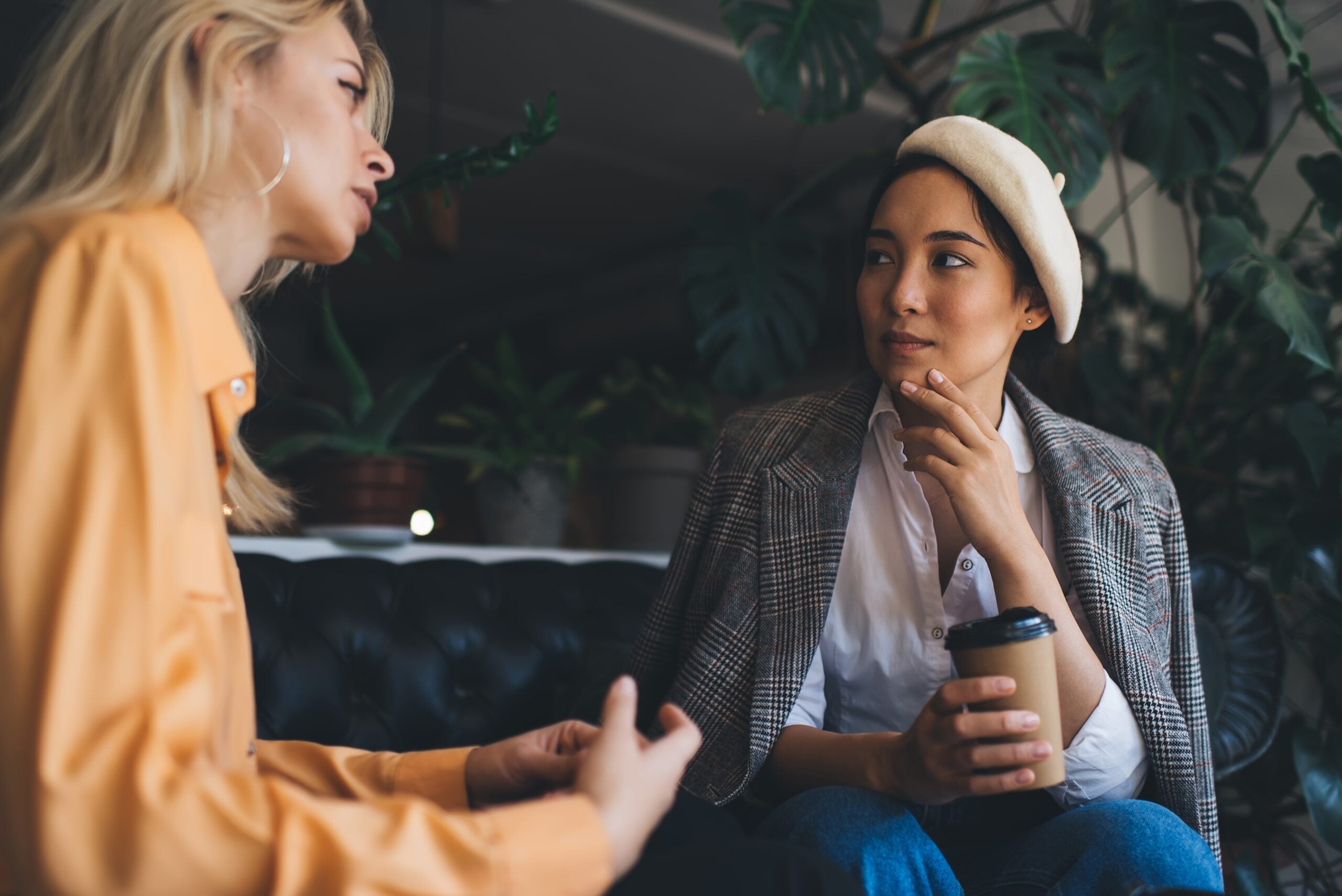Two girlfriends having a serious chat over coffee.