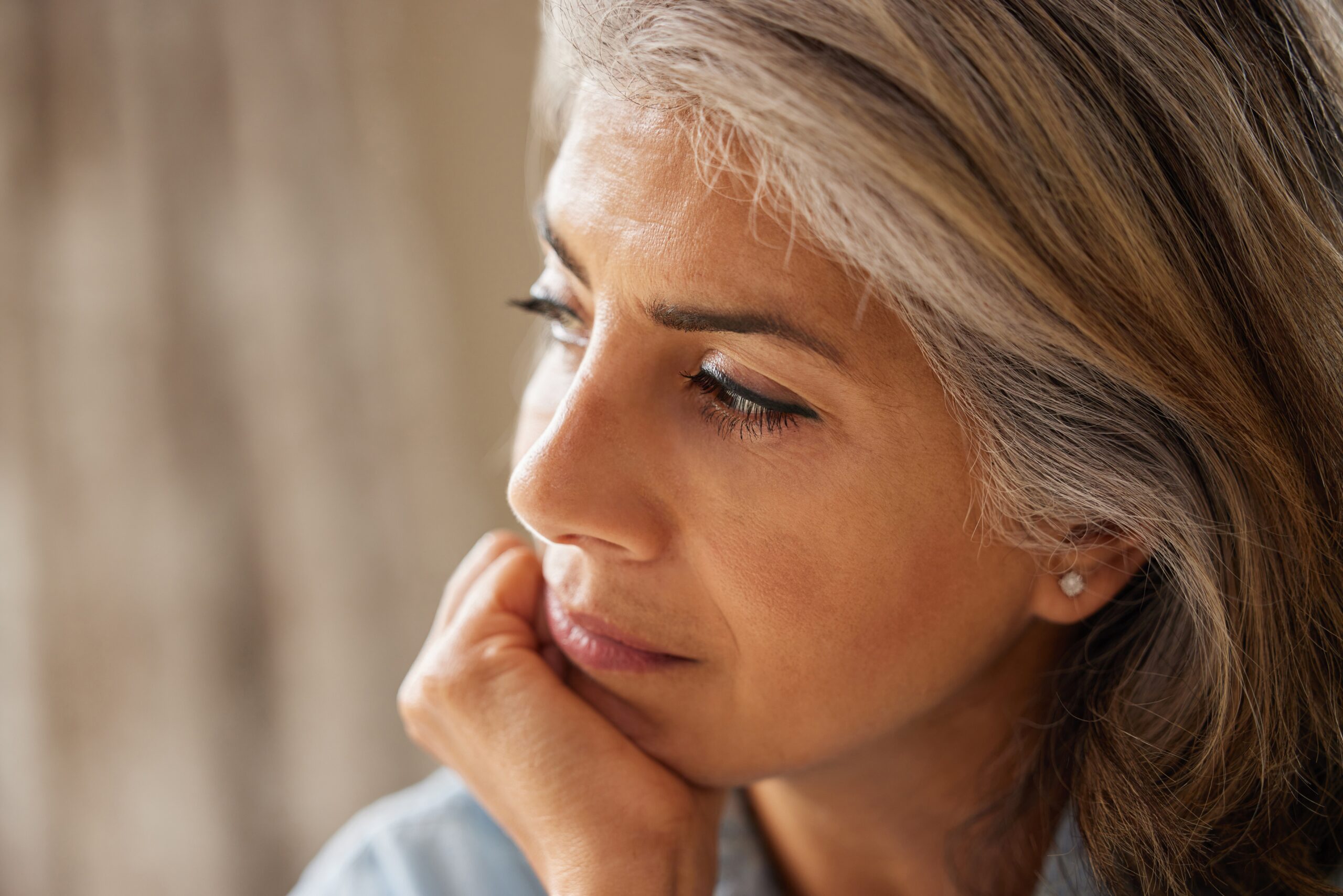 Woman sitting alone thinking about her life.