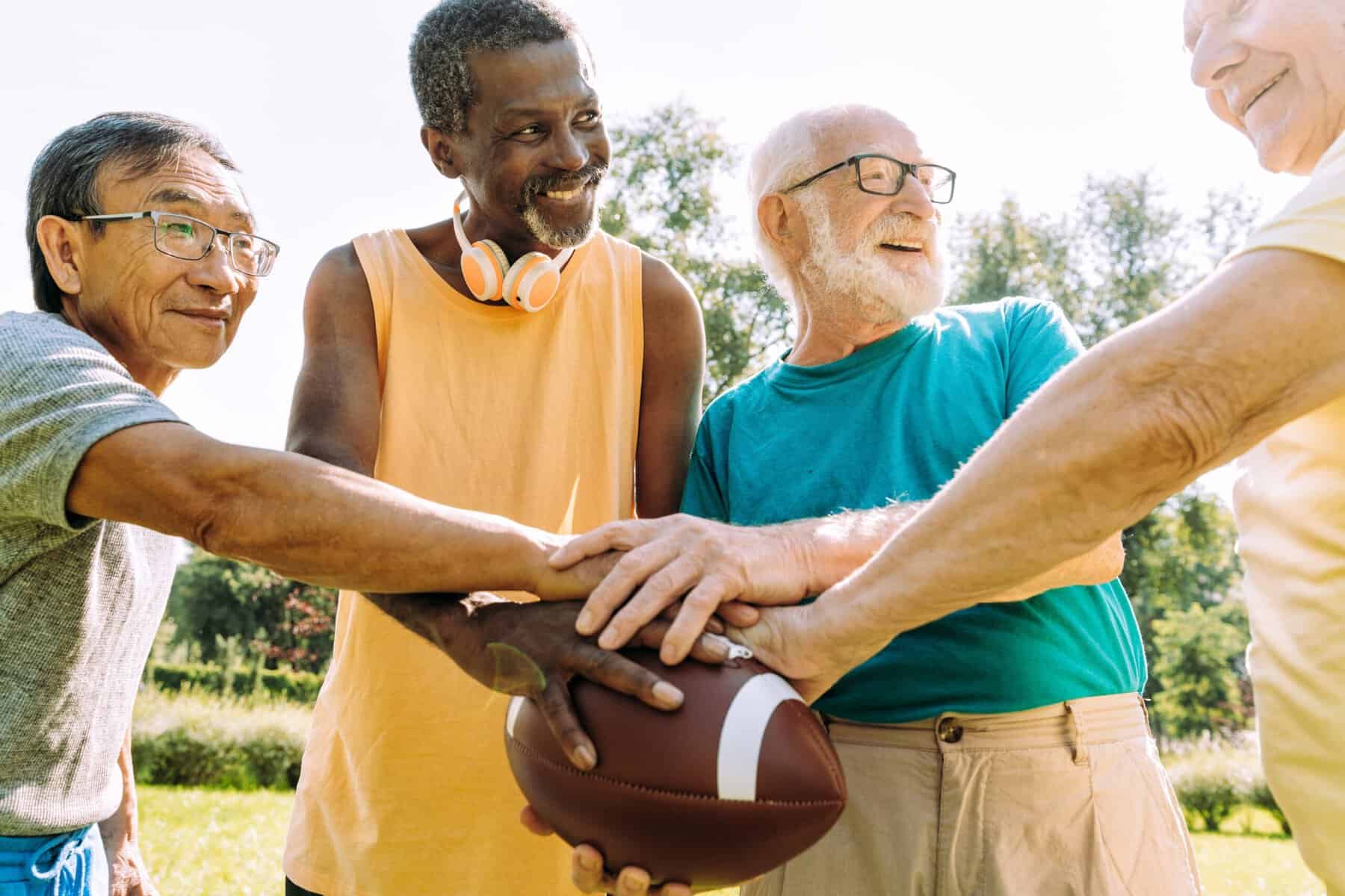 A group of senior friends playing at the park.