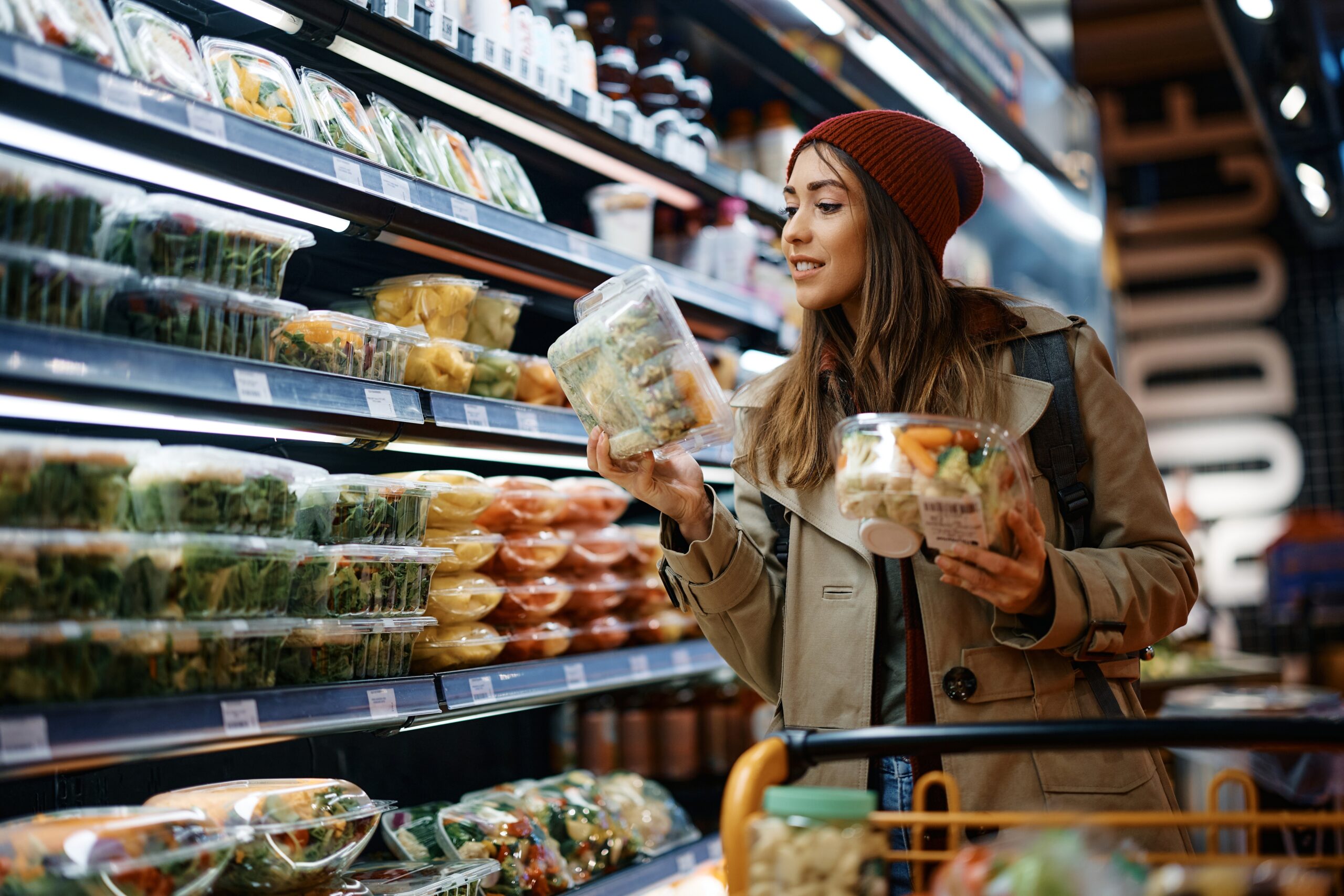 A woman enjoying her weekly grocery shopping.