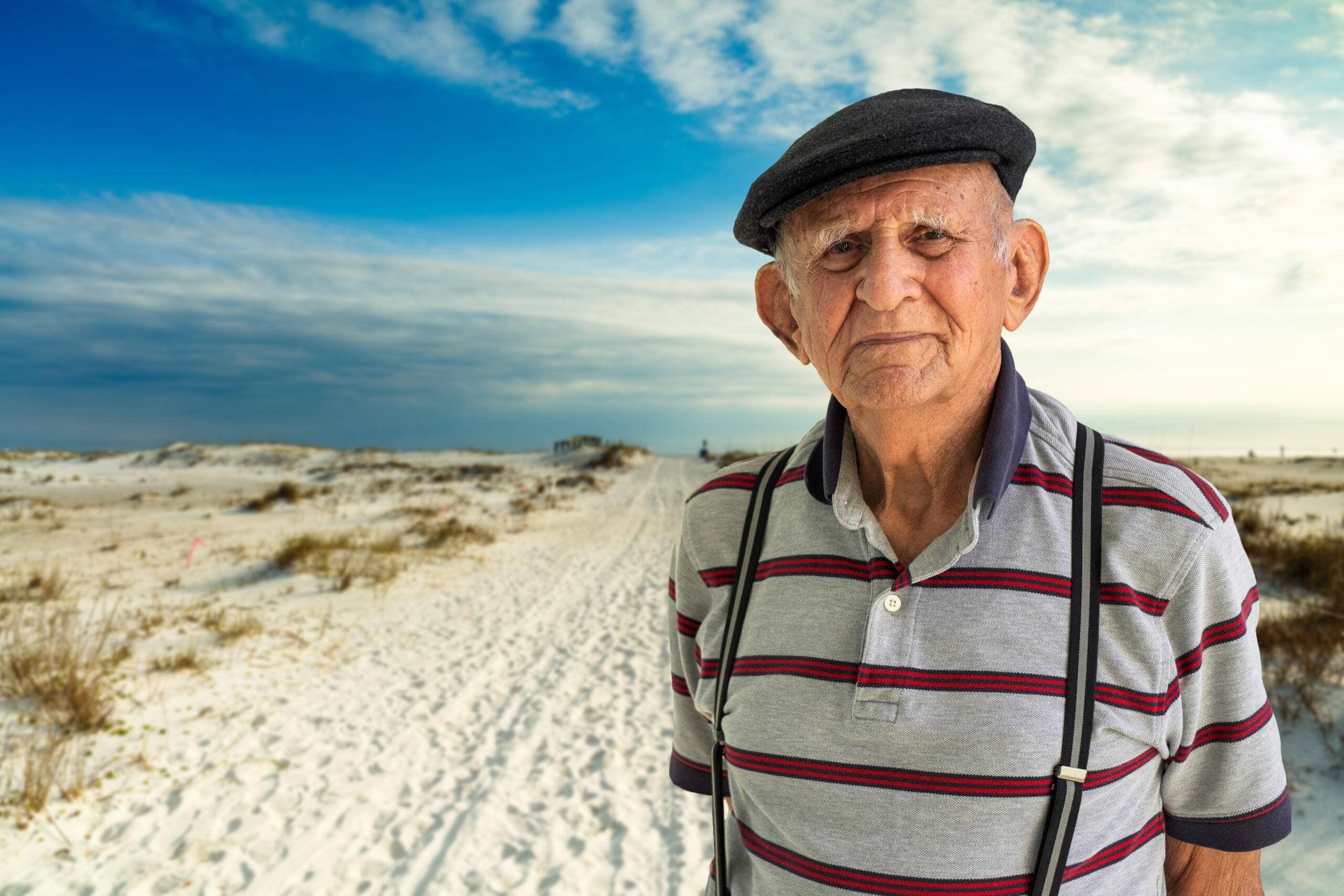 Elderly man on a walk on the beach.