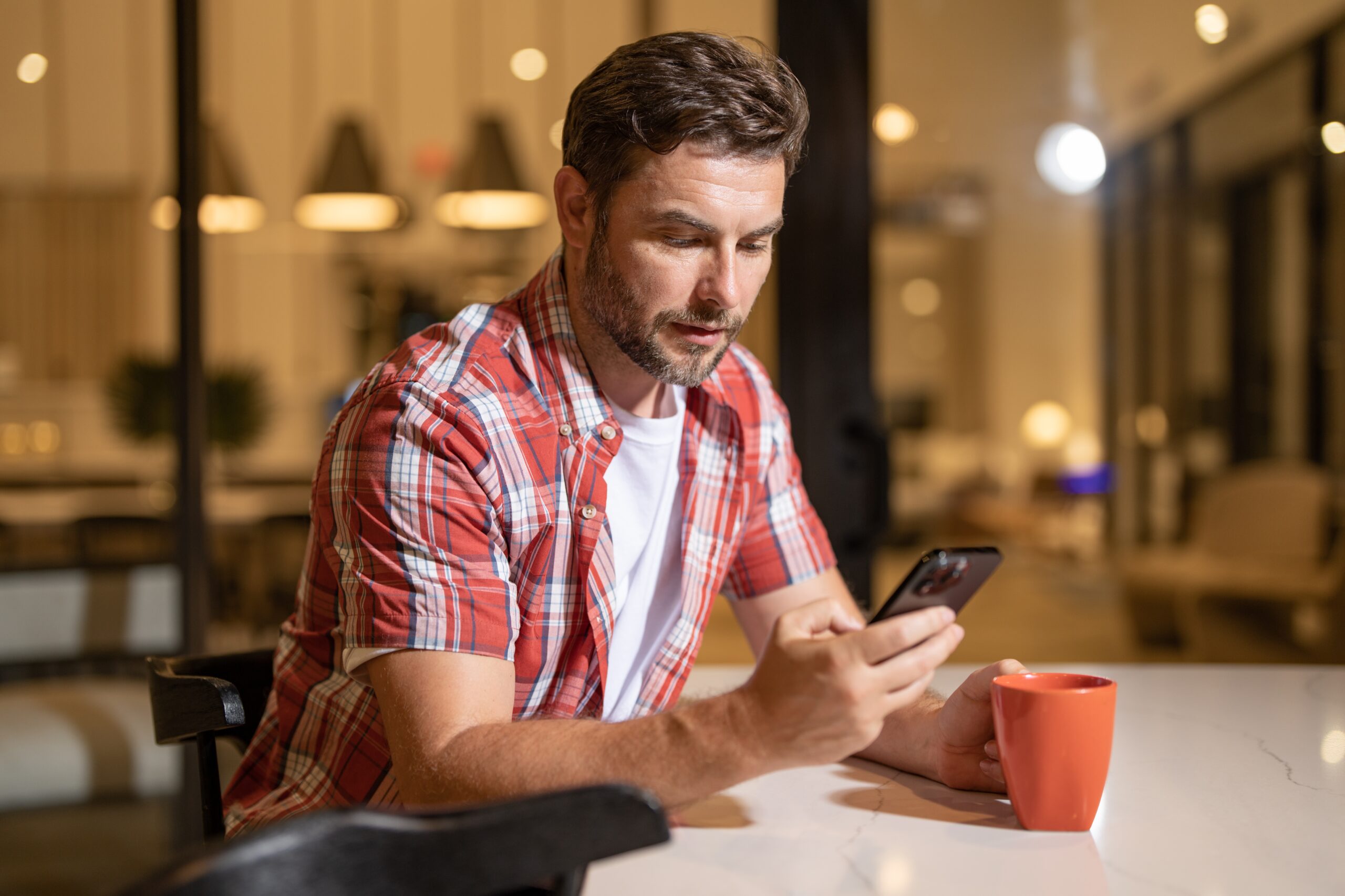 A man texting on his cell phone.