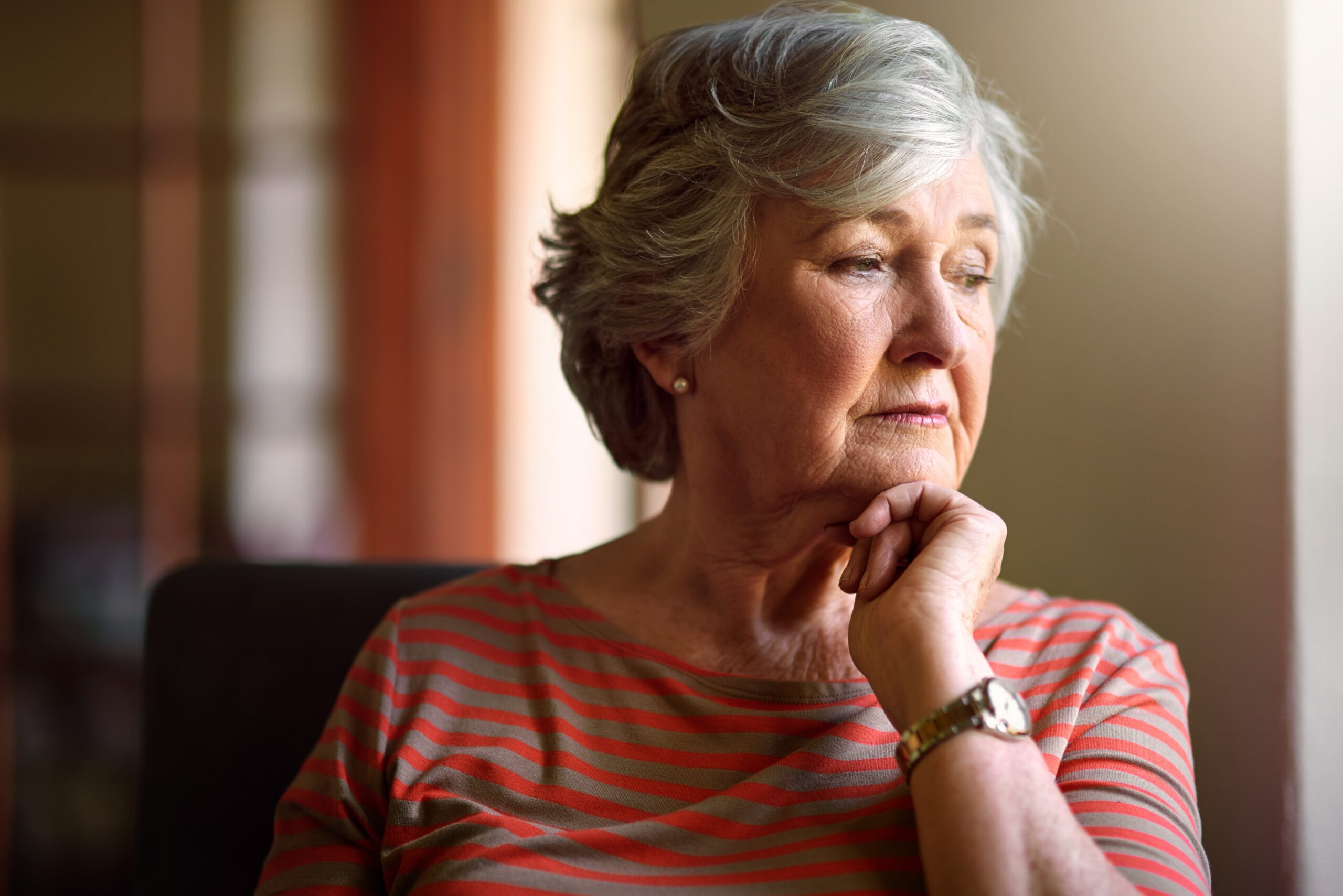 A senior woman thinking about feeling her age.