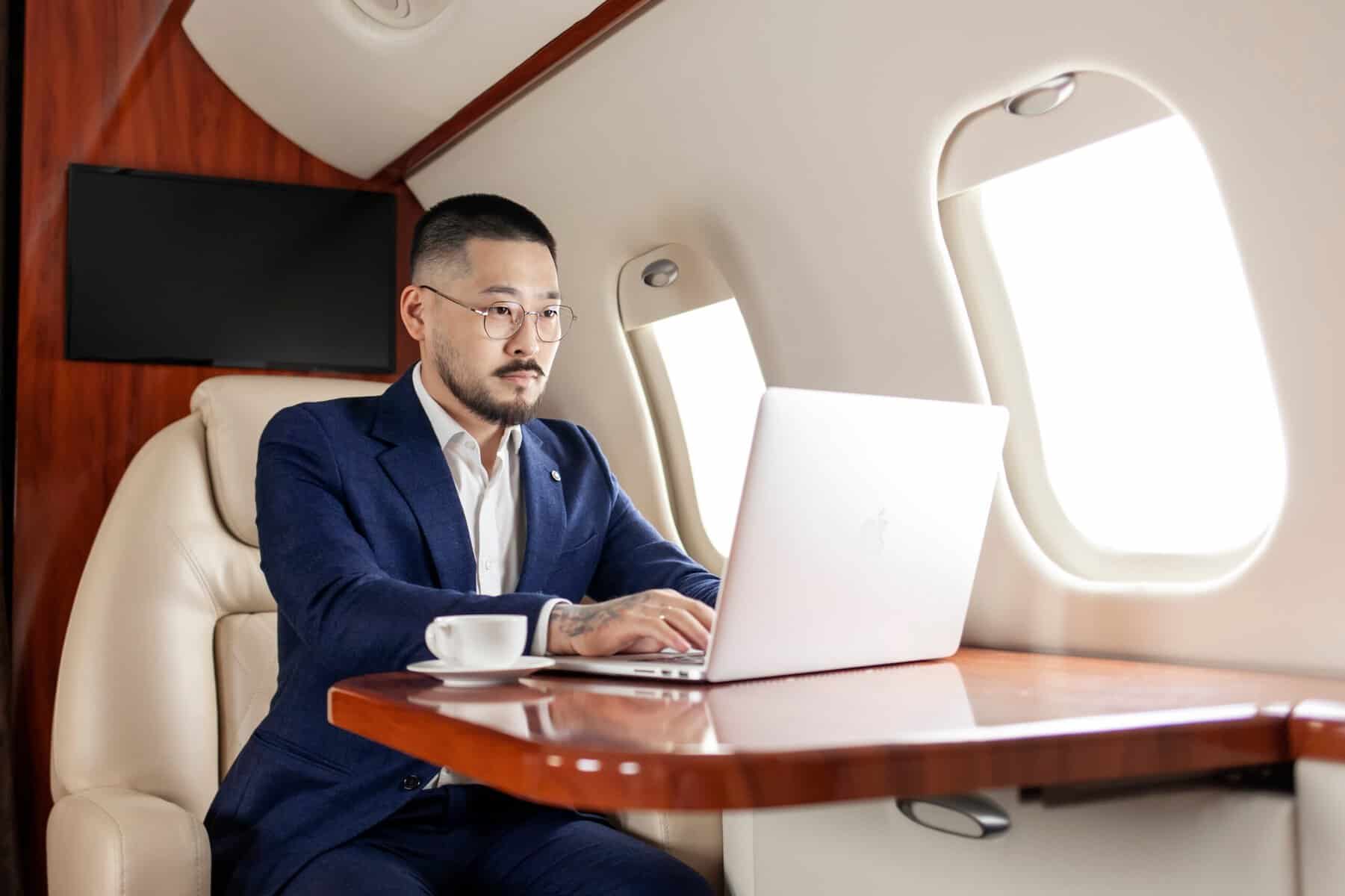Successful businessman flying in a private luxury plane.
