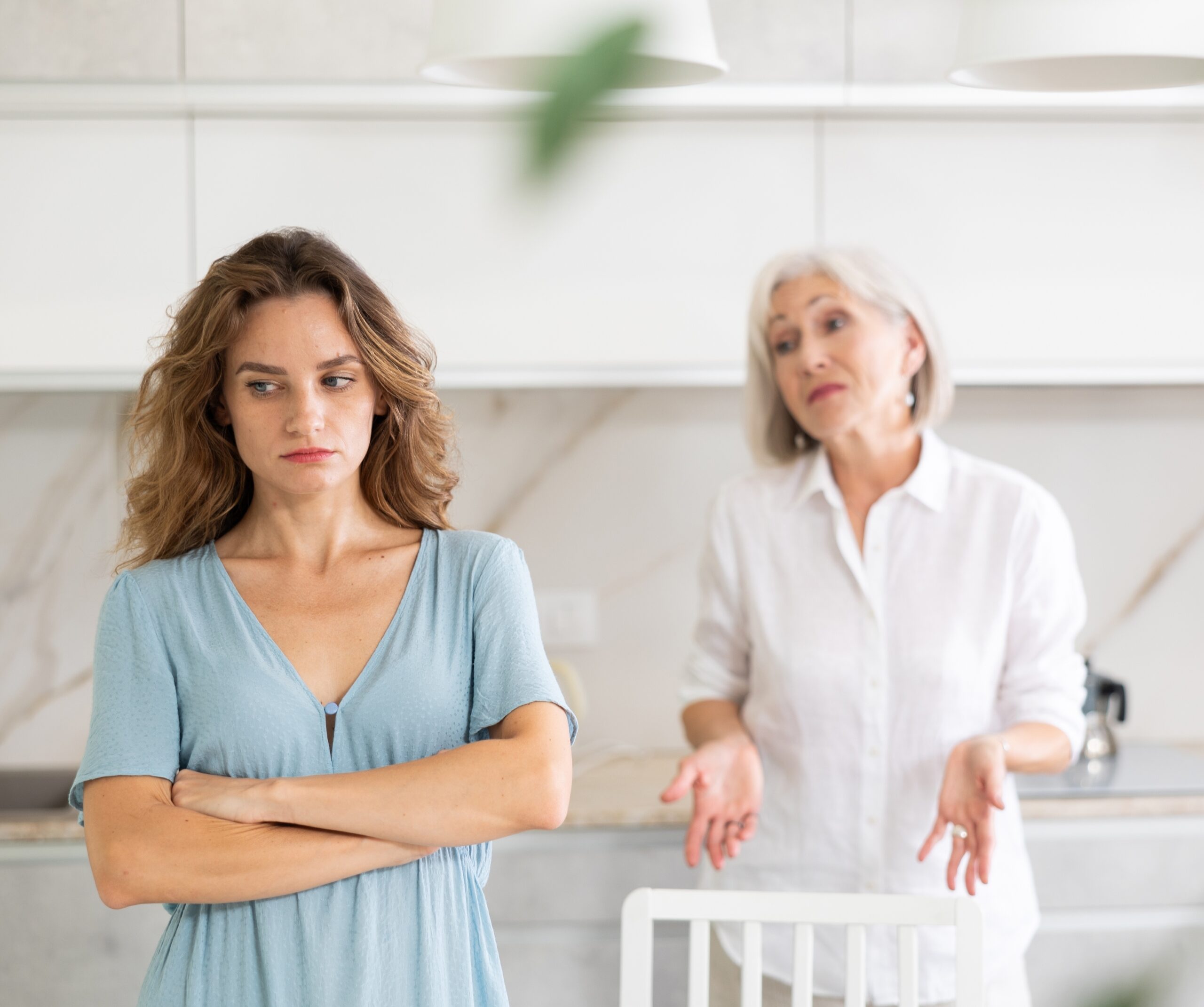 A senior woman giving her adult daughter unwanted life advice.