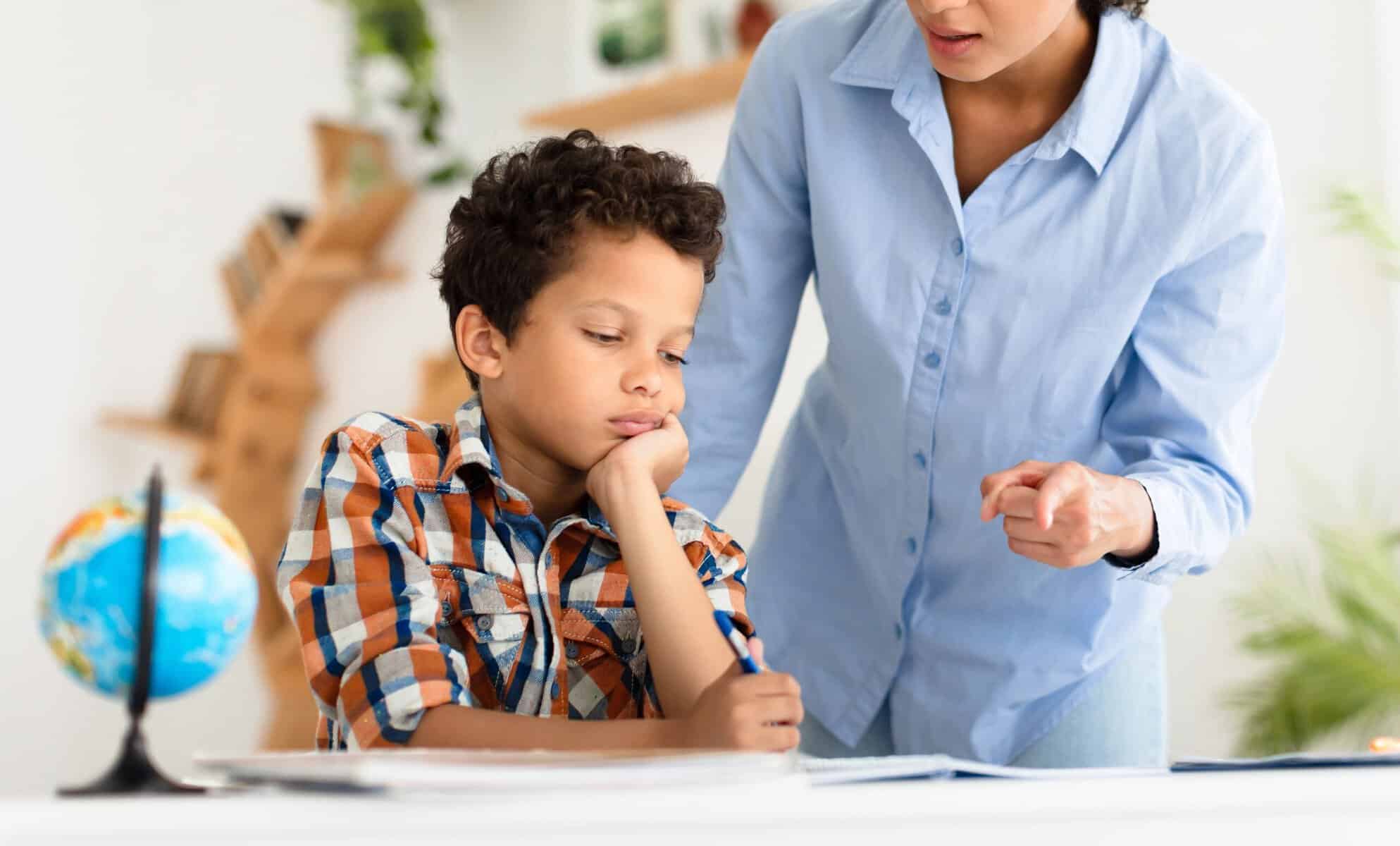 A young boy being criticized by his mother.