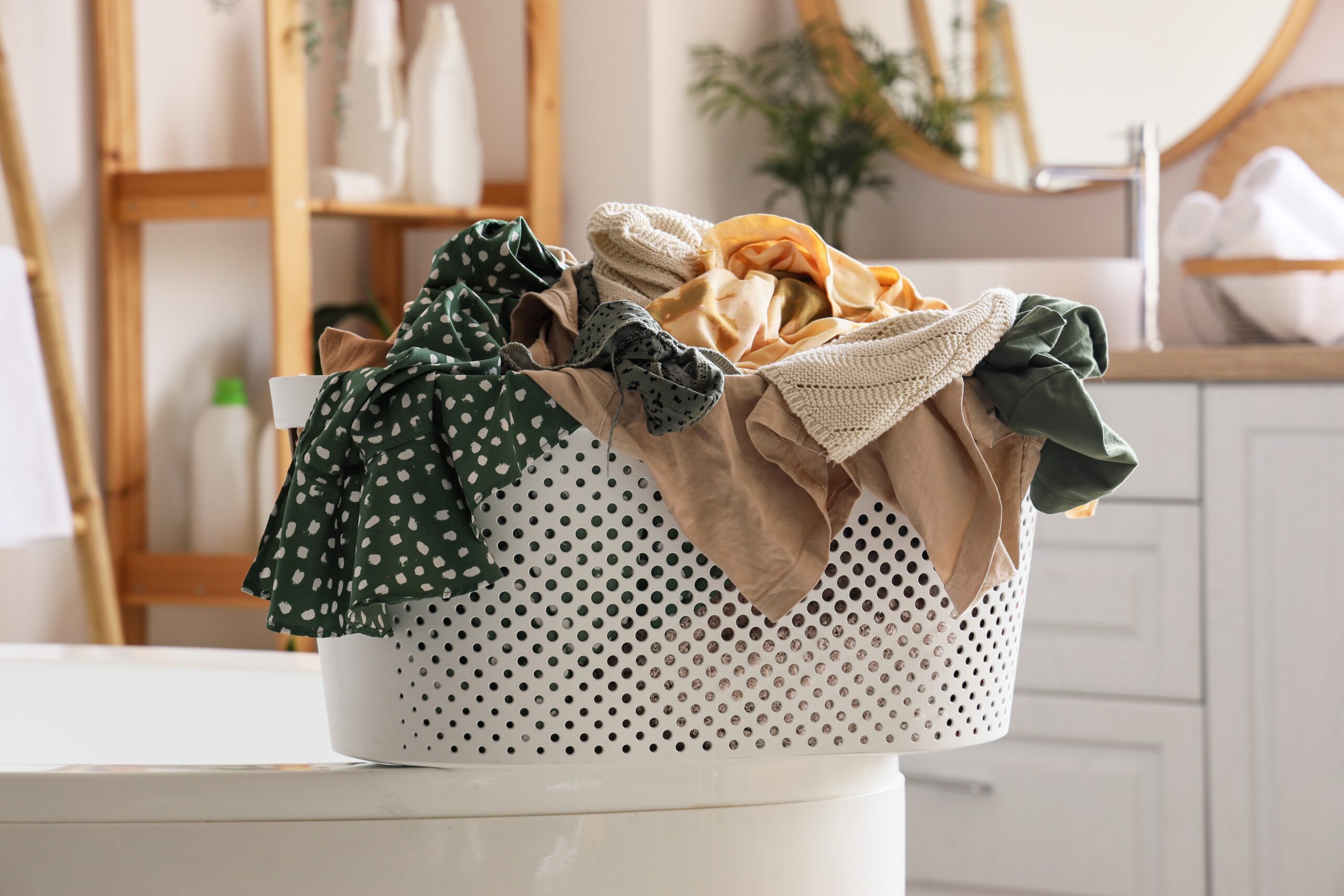 A full laundry basket waiting to be washed.