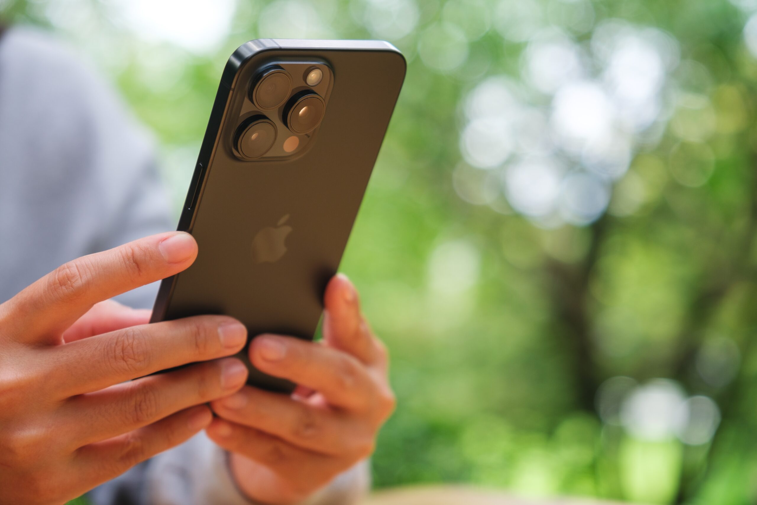 A woman silencing her cell phone.