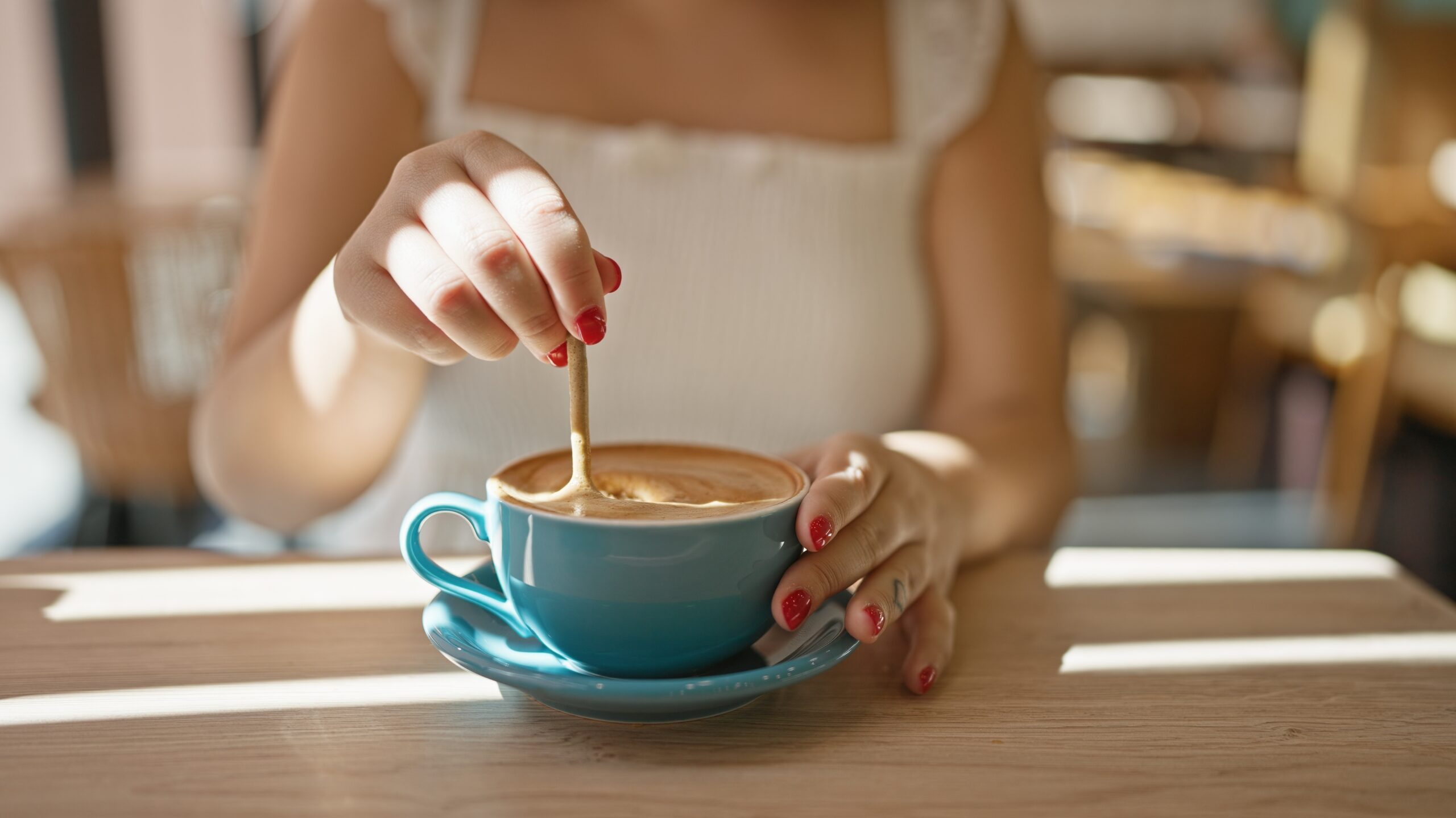 A woman enjoying a leisurely morning coffee.