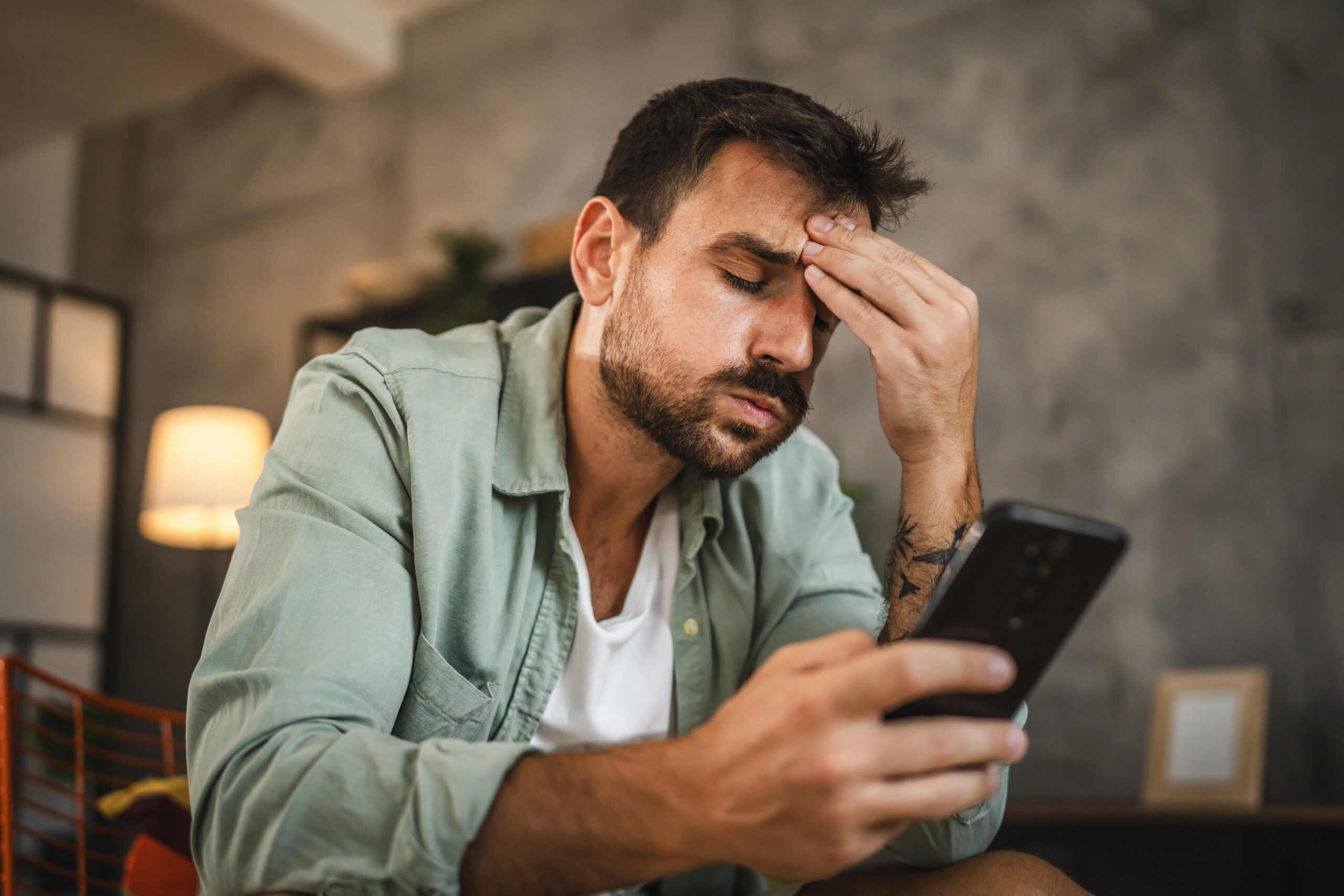 A frustrated man on his cell phone.