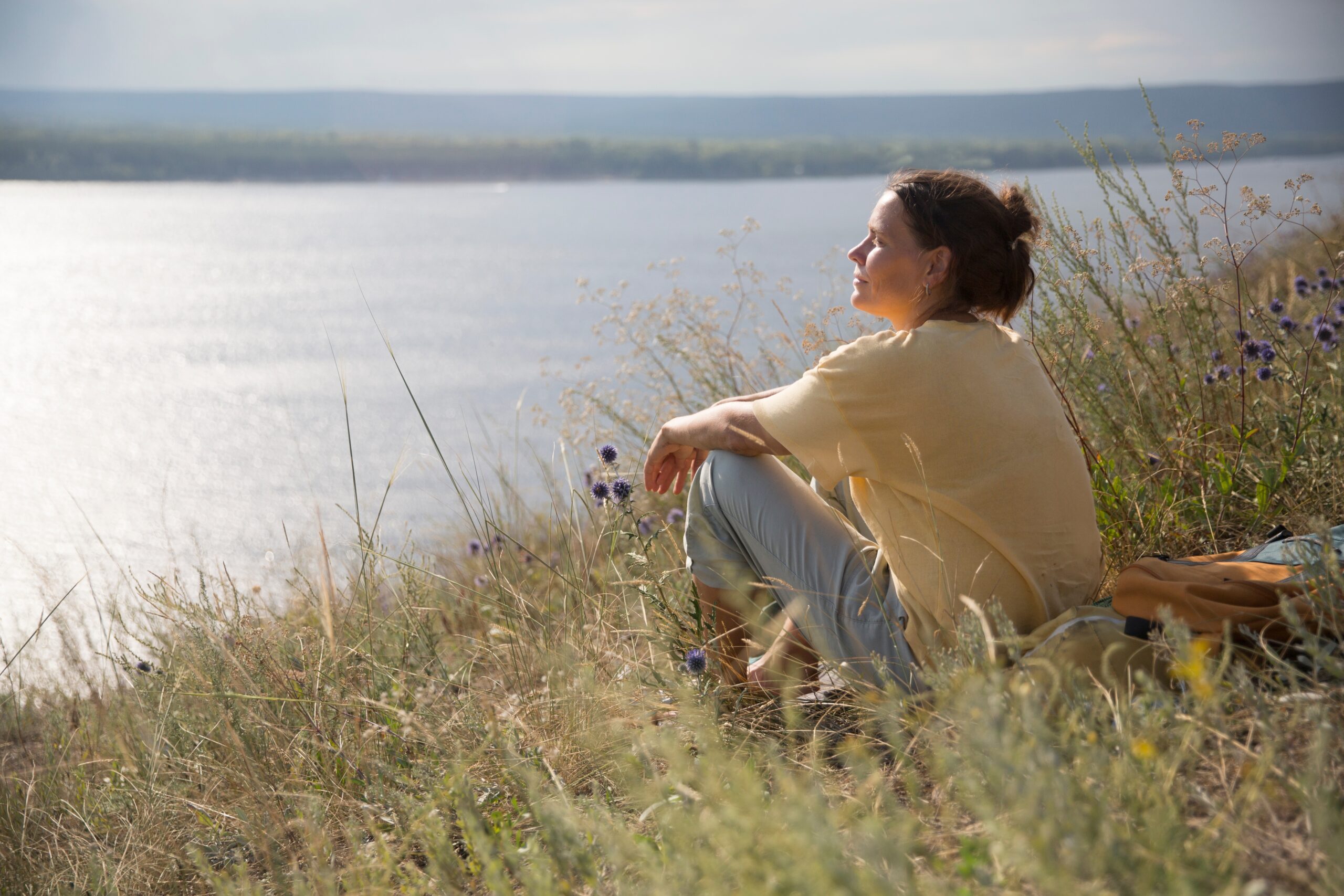 Content woman on a solo nature walk.
