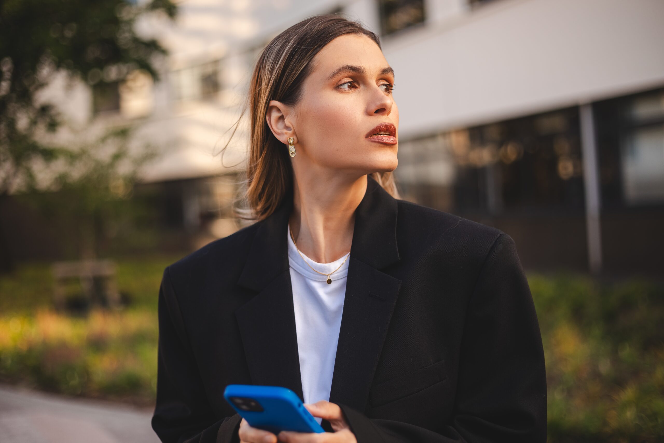 A confident businesswoman on her way to a meeting.