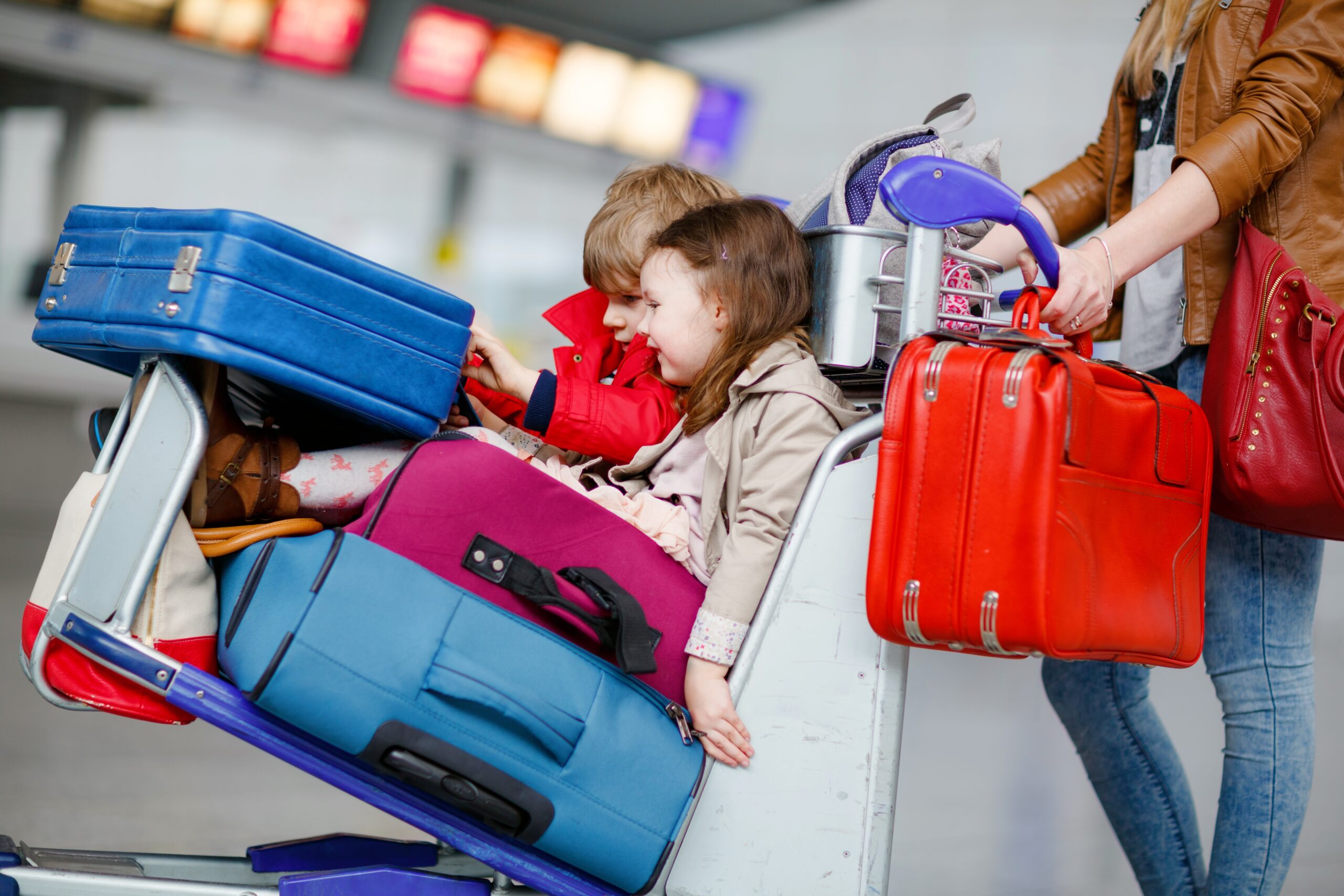 A mother with her children arriving early to the airport.