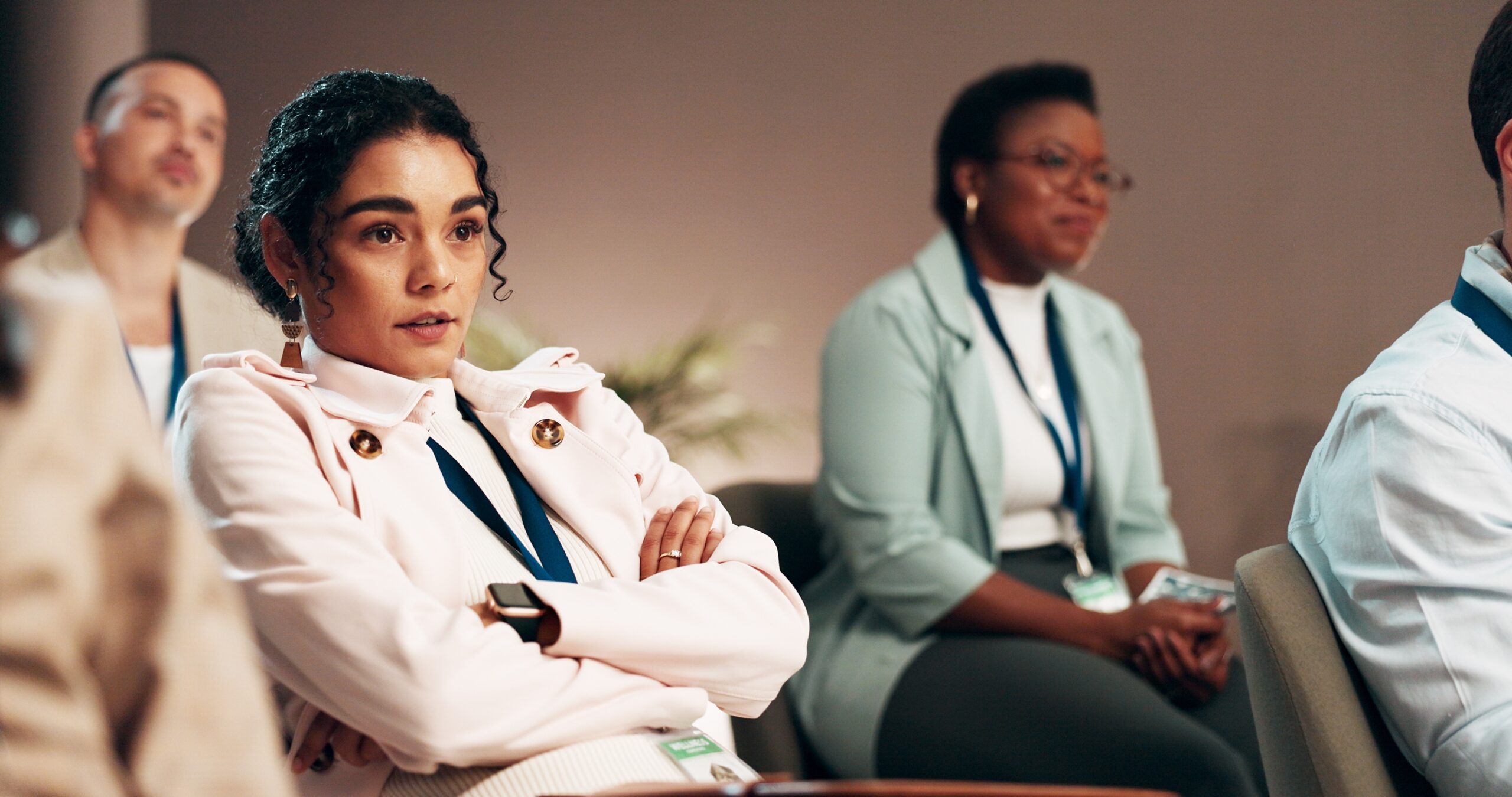 Work colleagues sitting in a presentation together.