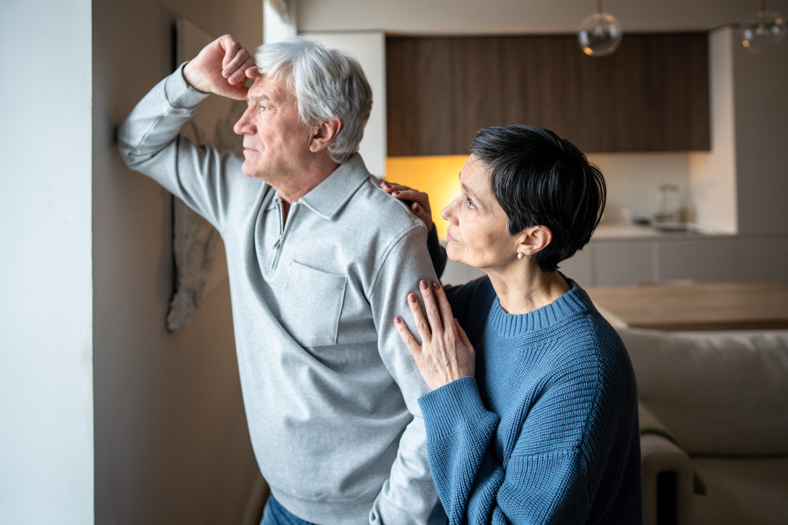 A woman apologizing to her husband for something she's done.