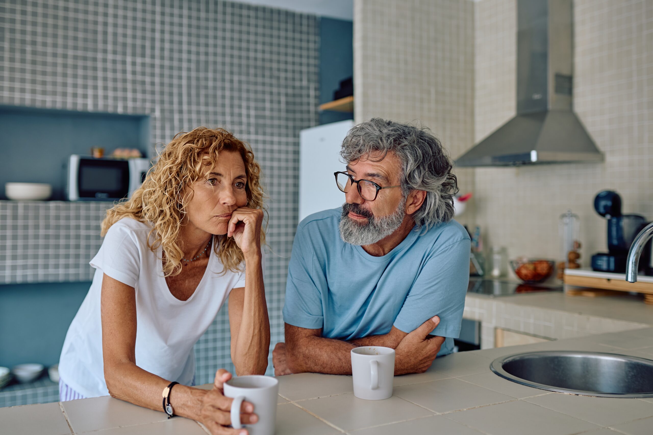 A senior couple having a disagreement at home.