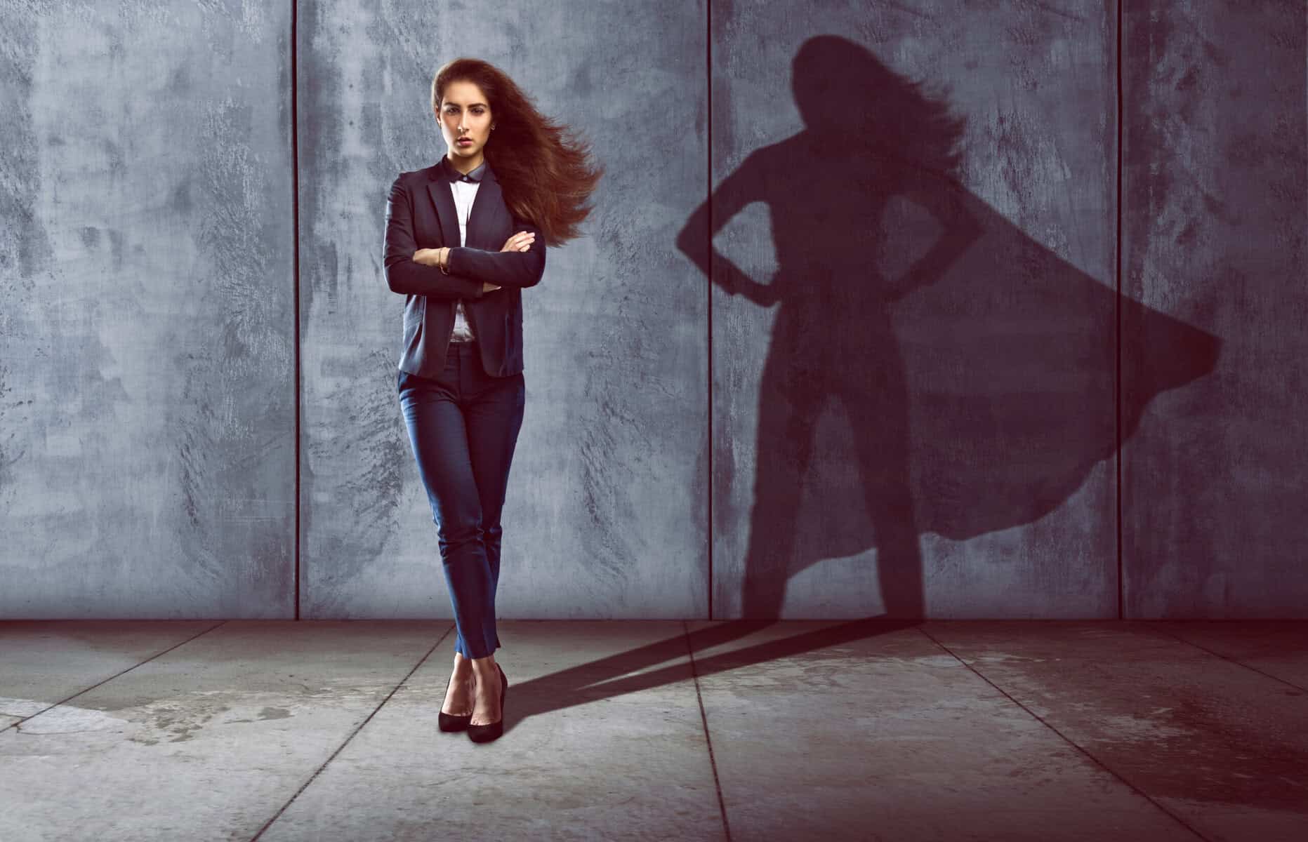 Confident, independent woman looking like a superhero.