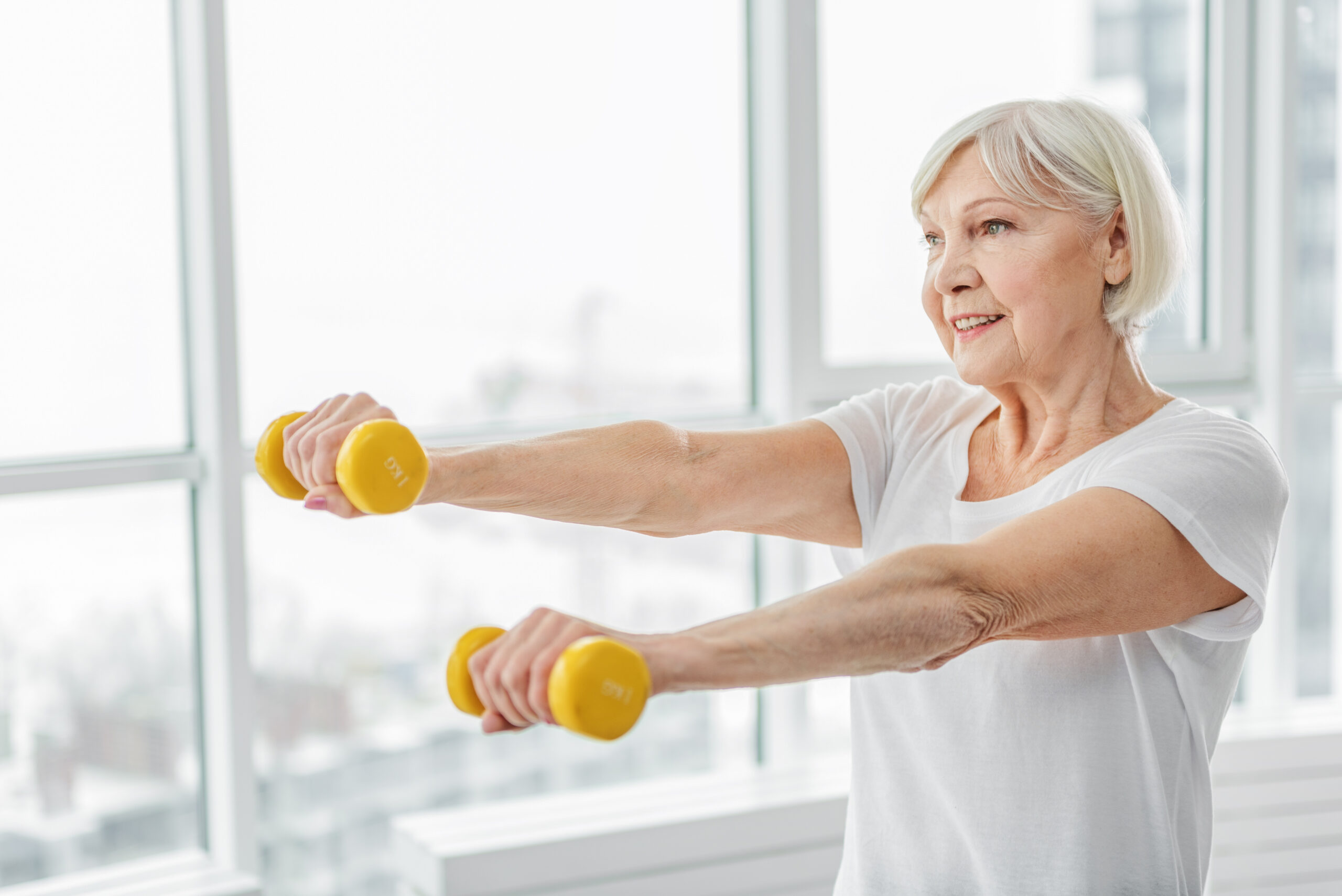 Senior woman getting morning exercise in.