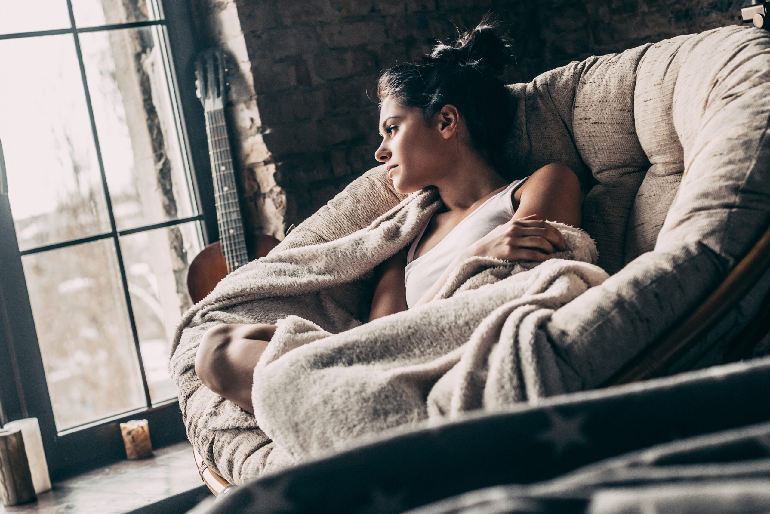 A woman struggling at home alone.