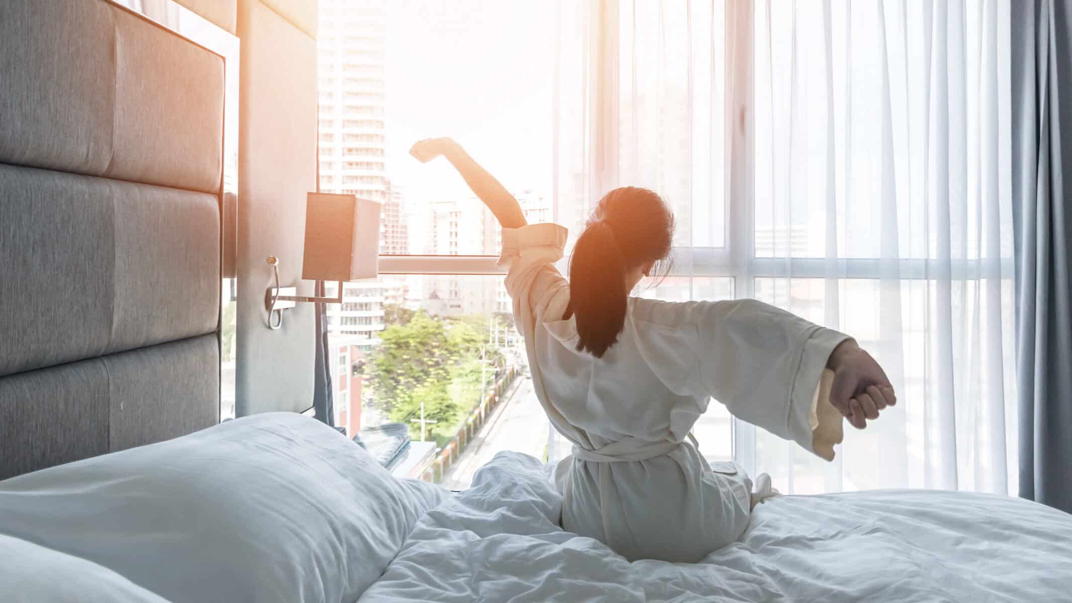 Woman waking up after a great night's sleep.
