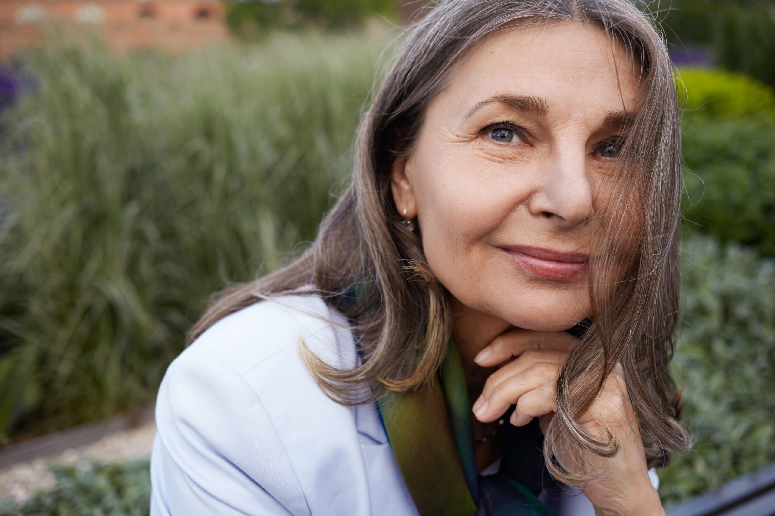 Women in her 60s look happy and content.