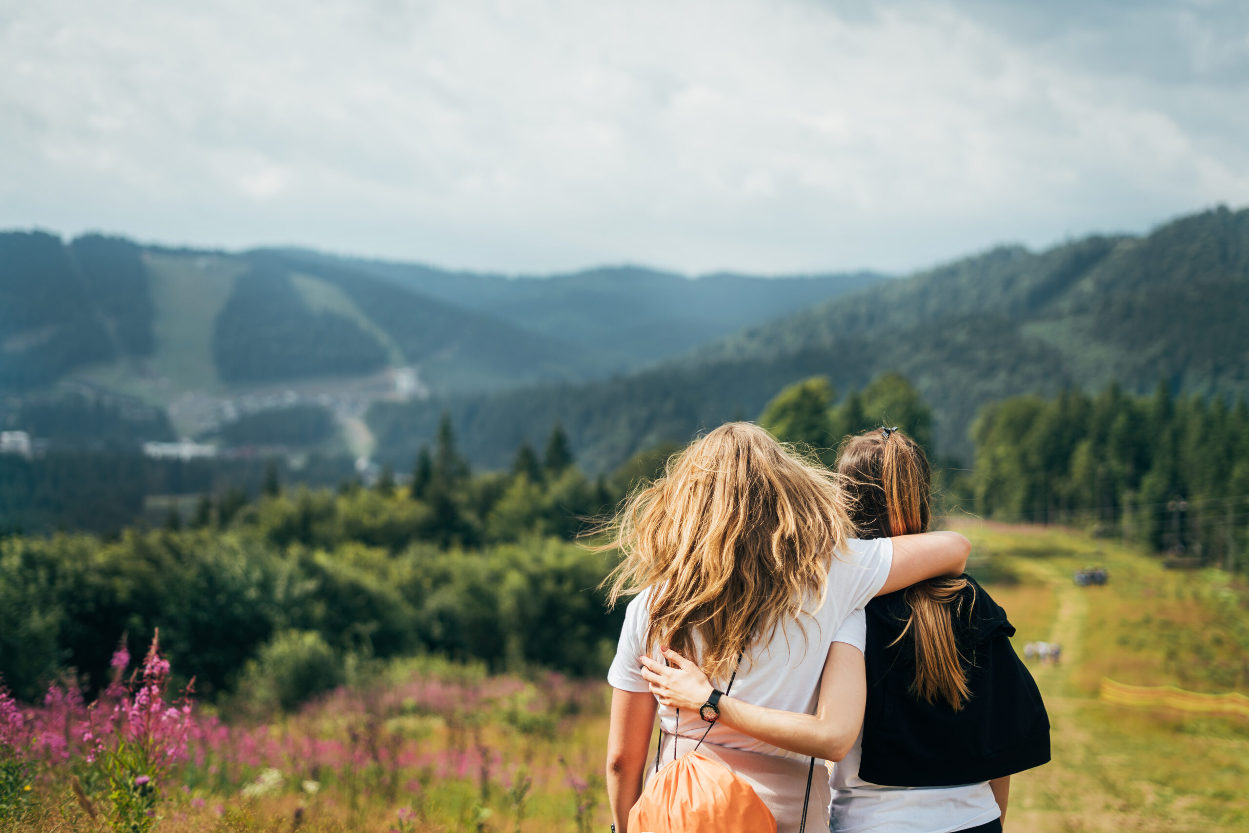Two female friends on a nature walk.