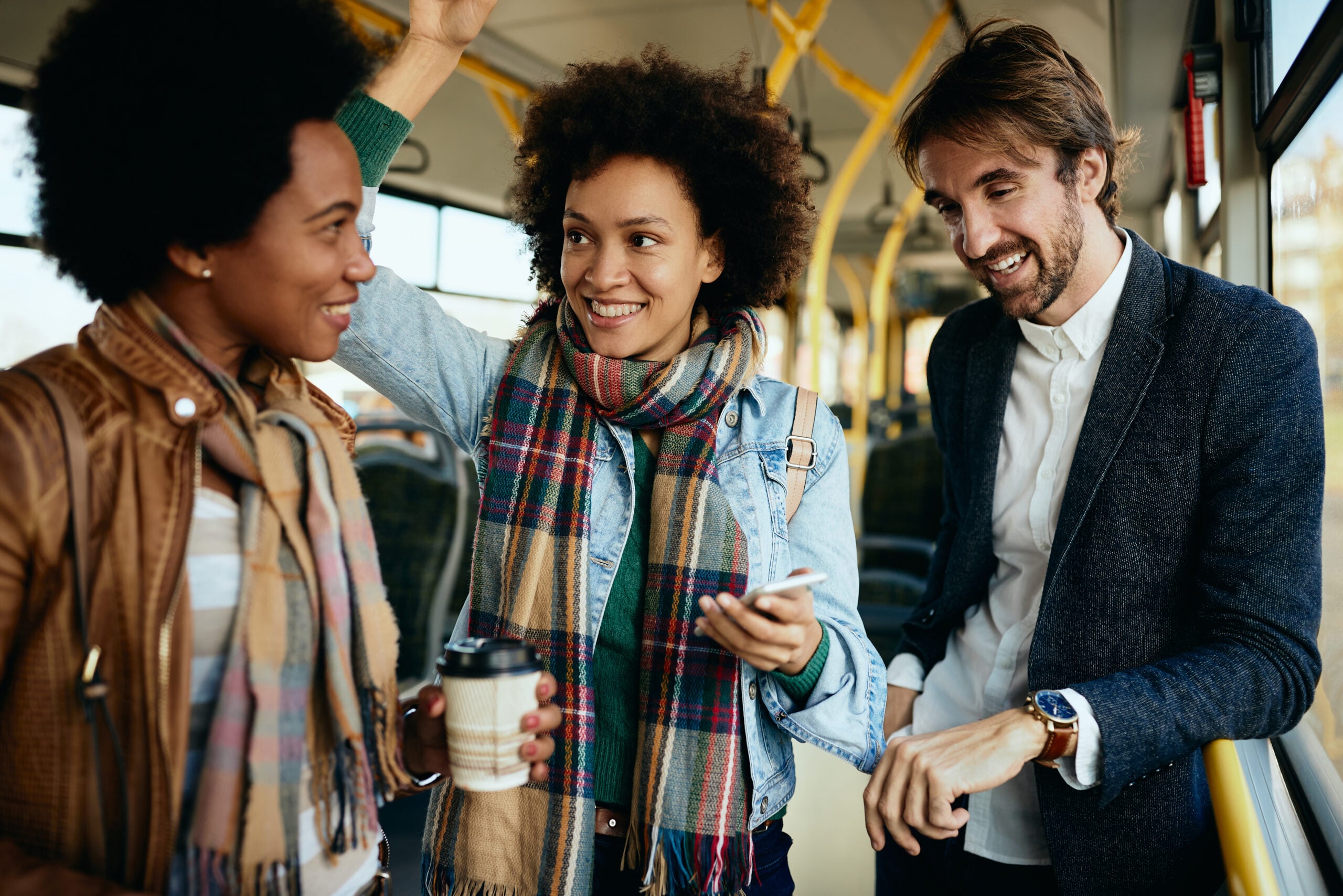 Three people making small talk on their commute.
