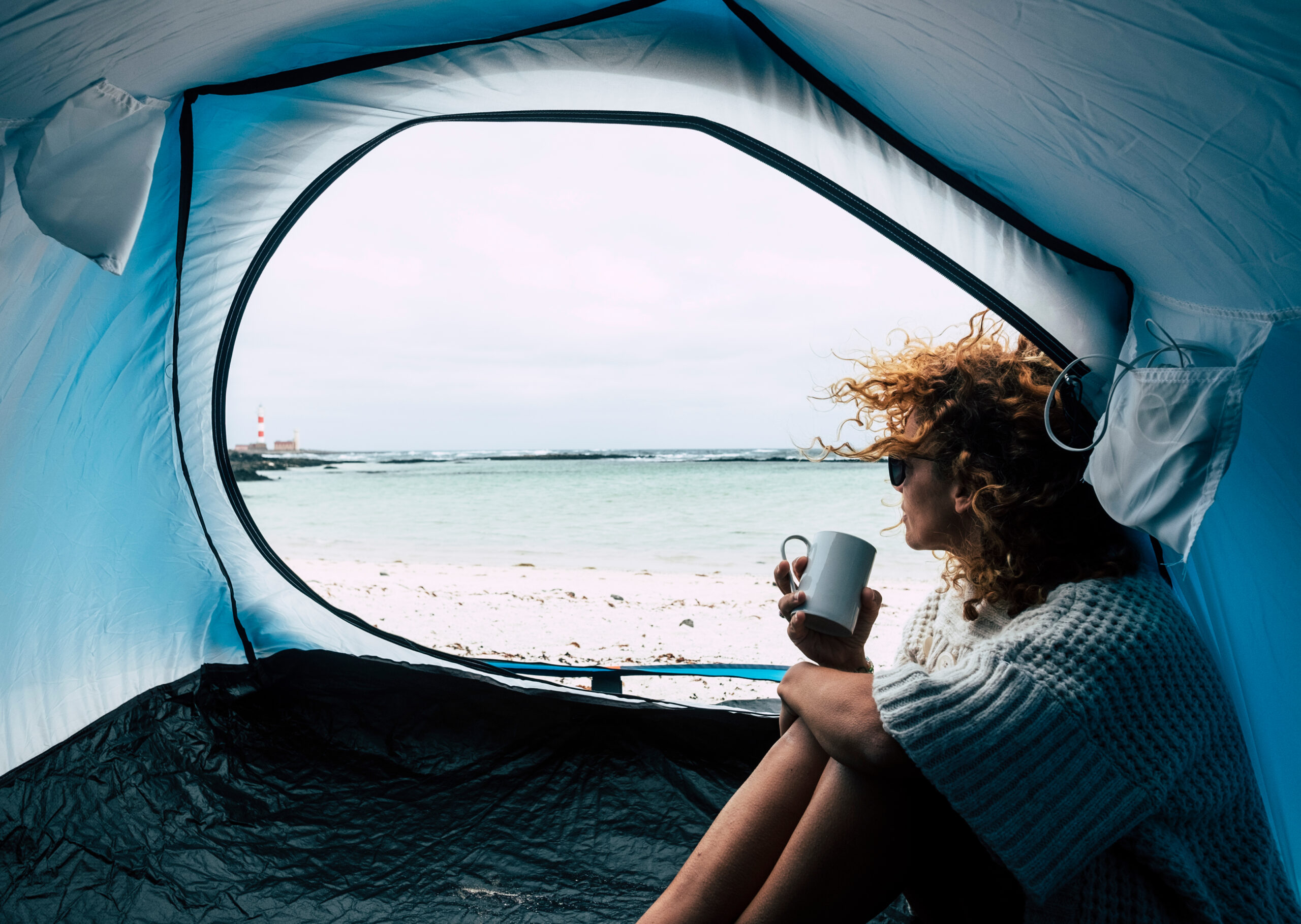An independent woman camping on her own.