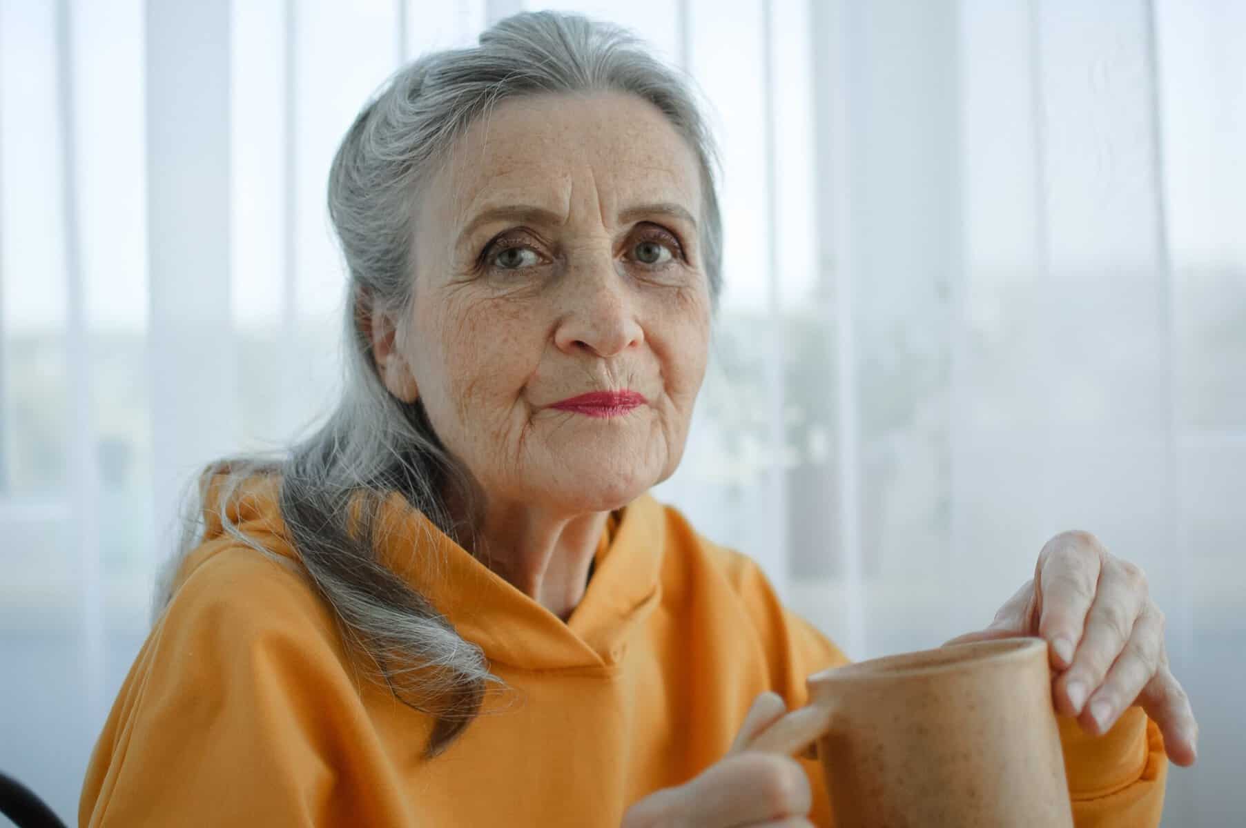 A withdrawn midlife woman alone at home after cancelling plans.