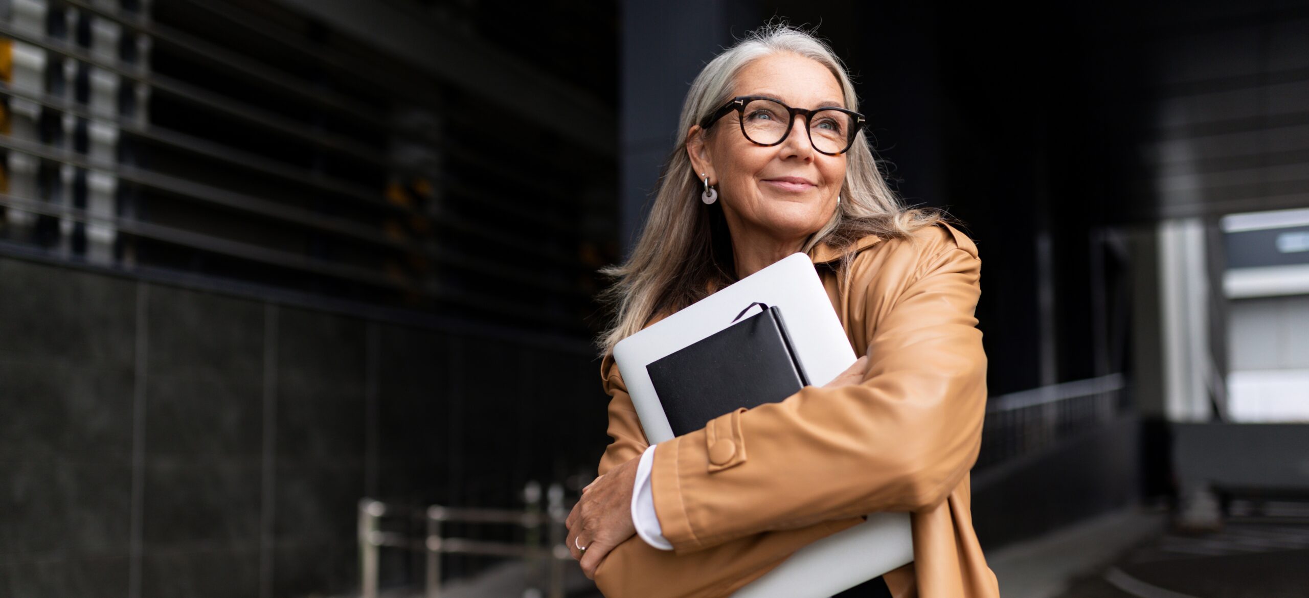 A confident middle aged woman walking on the street.