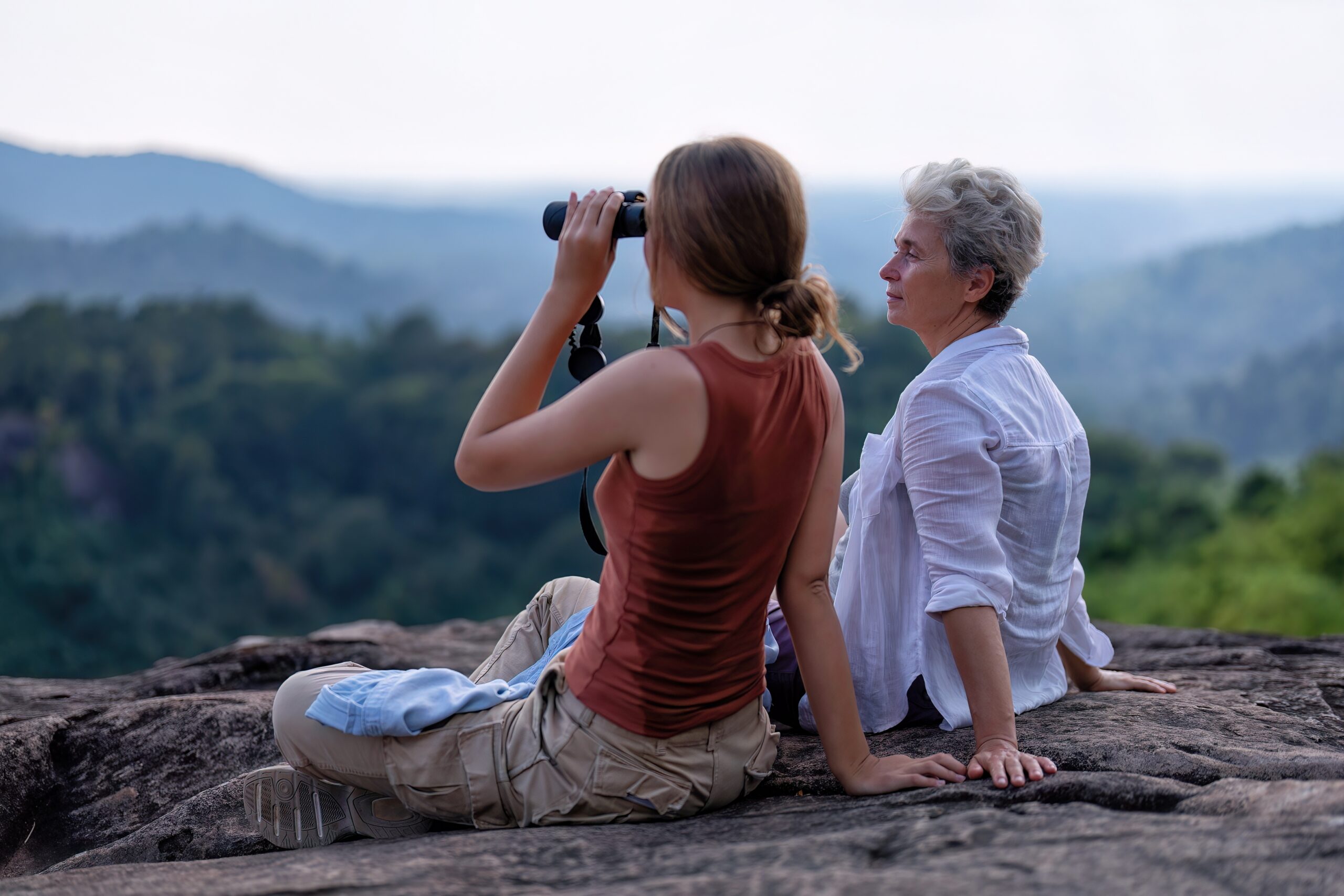 A mother and her daughter on a hike together.