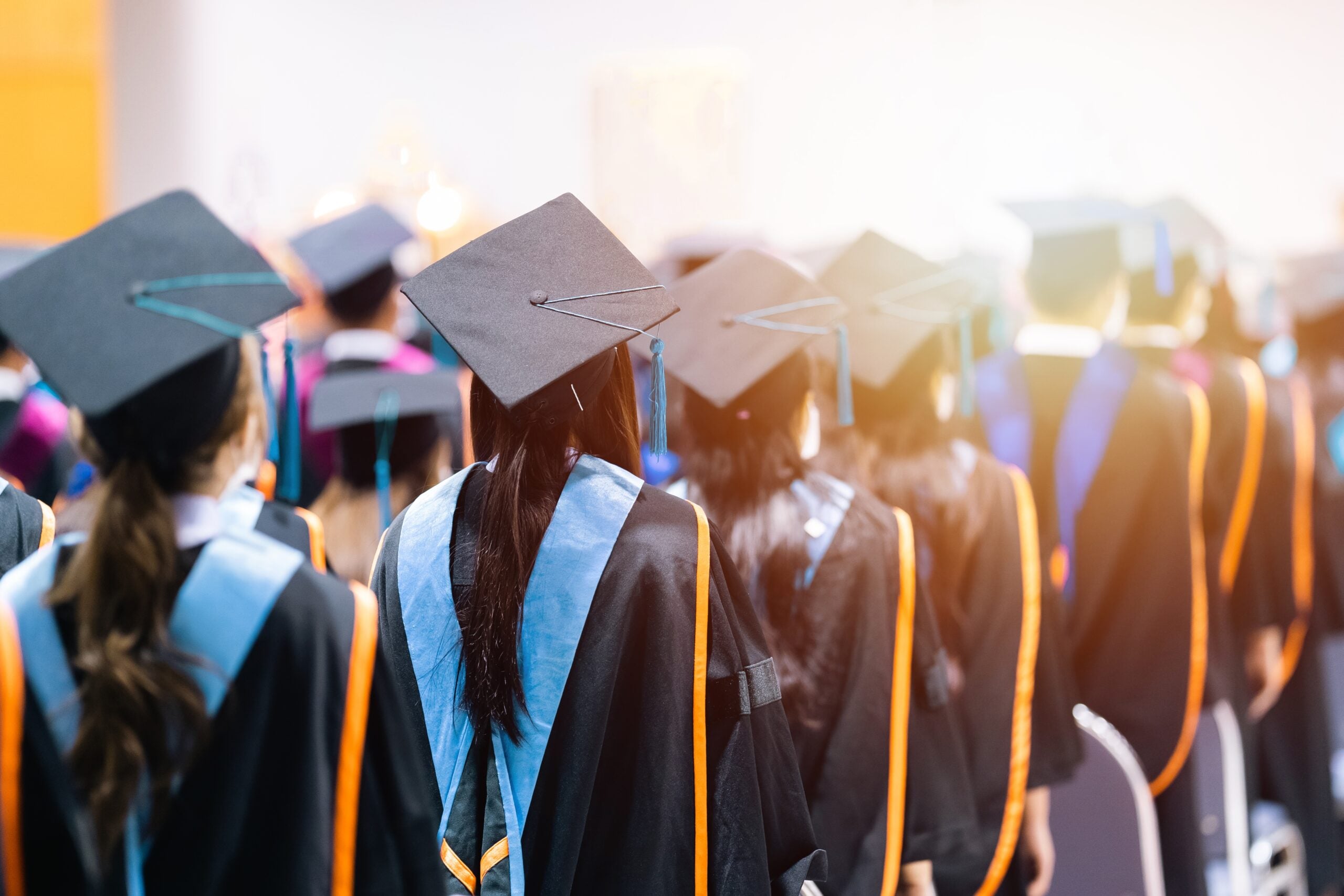 University graduates wearing academic gowns on commencement day.
