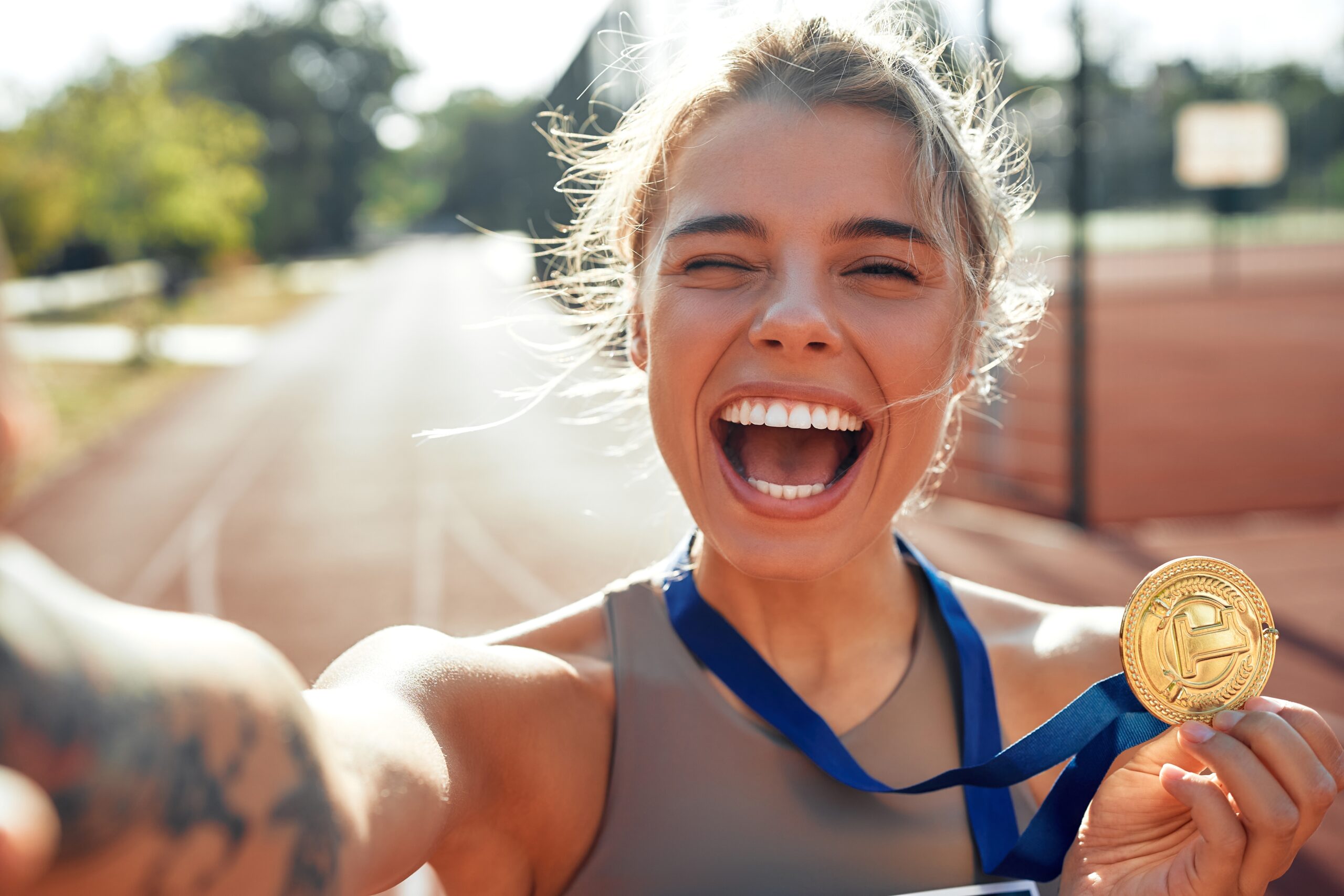 A woman who has just finished running a road race.