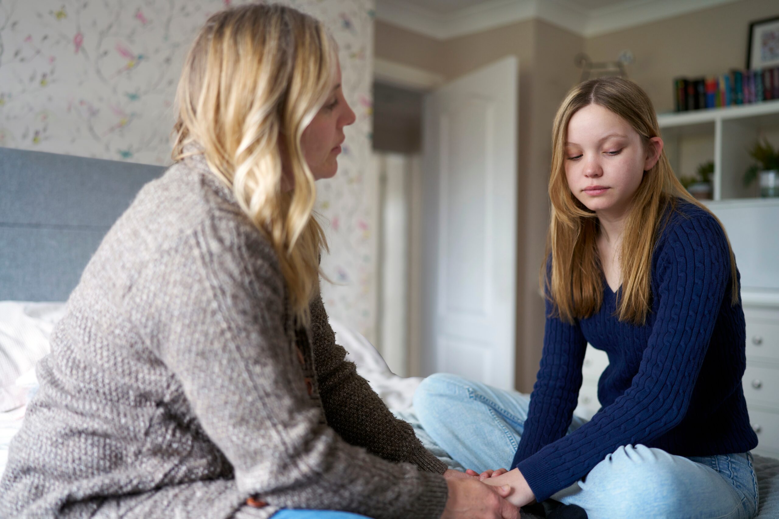 An anxious mother speaking with her daughter.