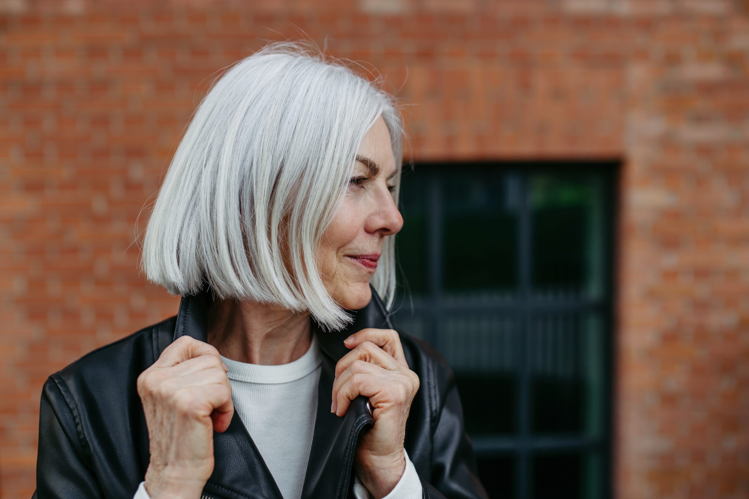 A beautiful middle aged woman with gray hair.