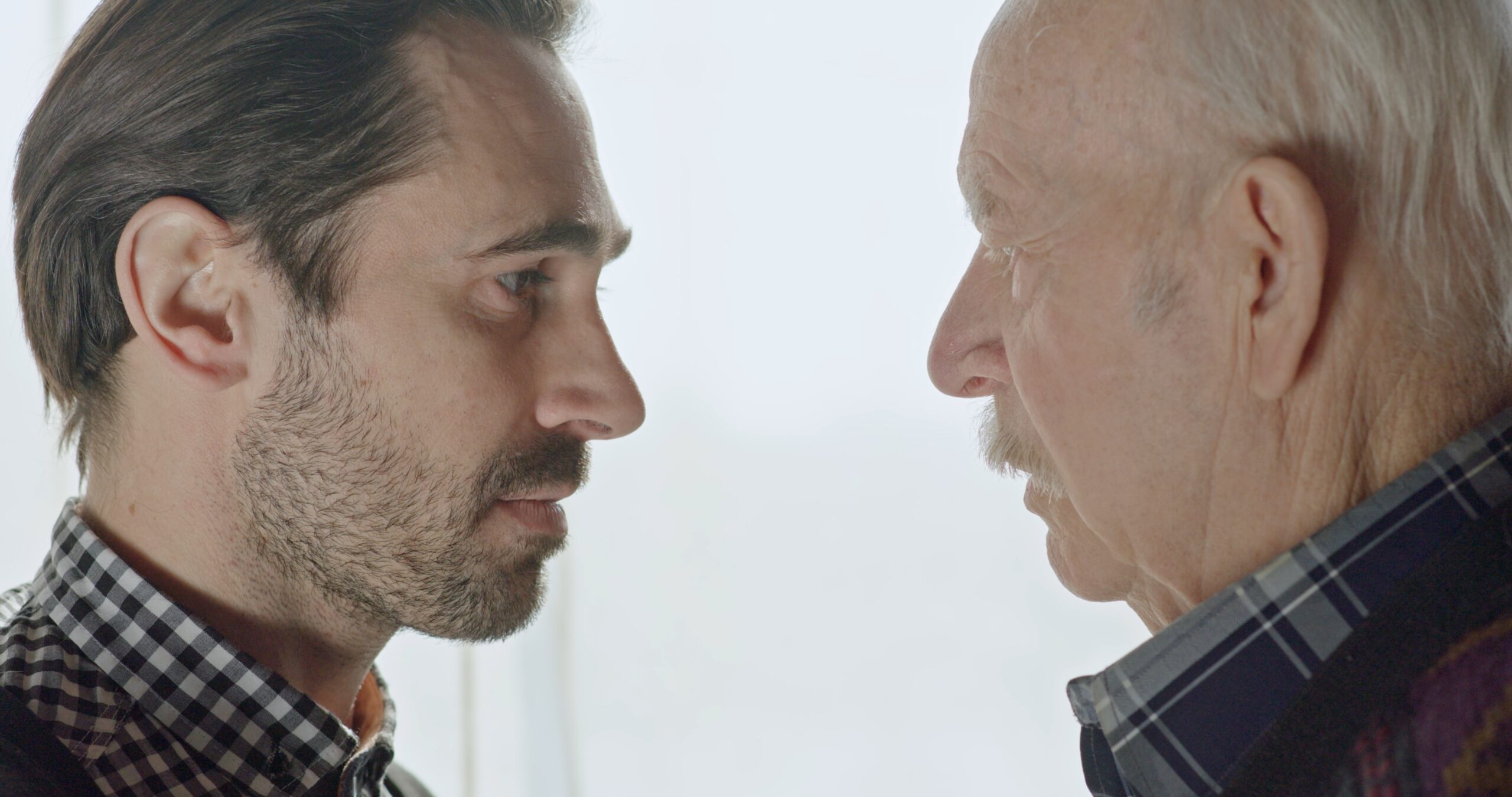 An adult son with his senior father.