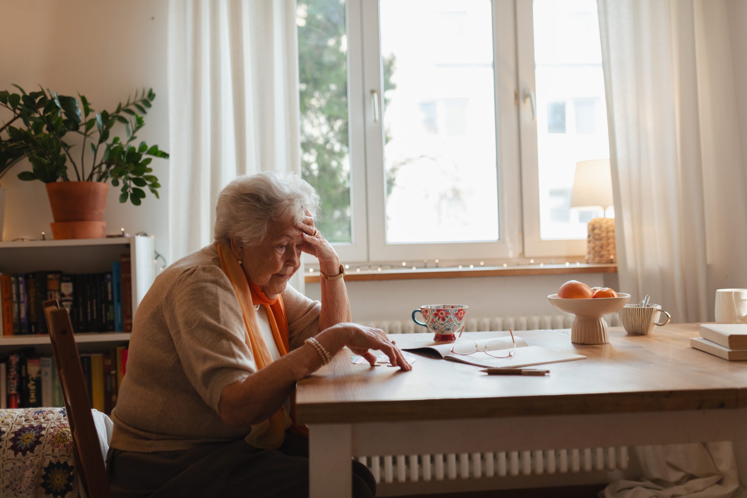 A senior woman waiting for her child to call.