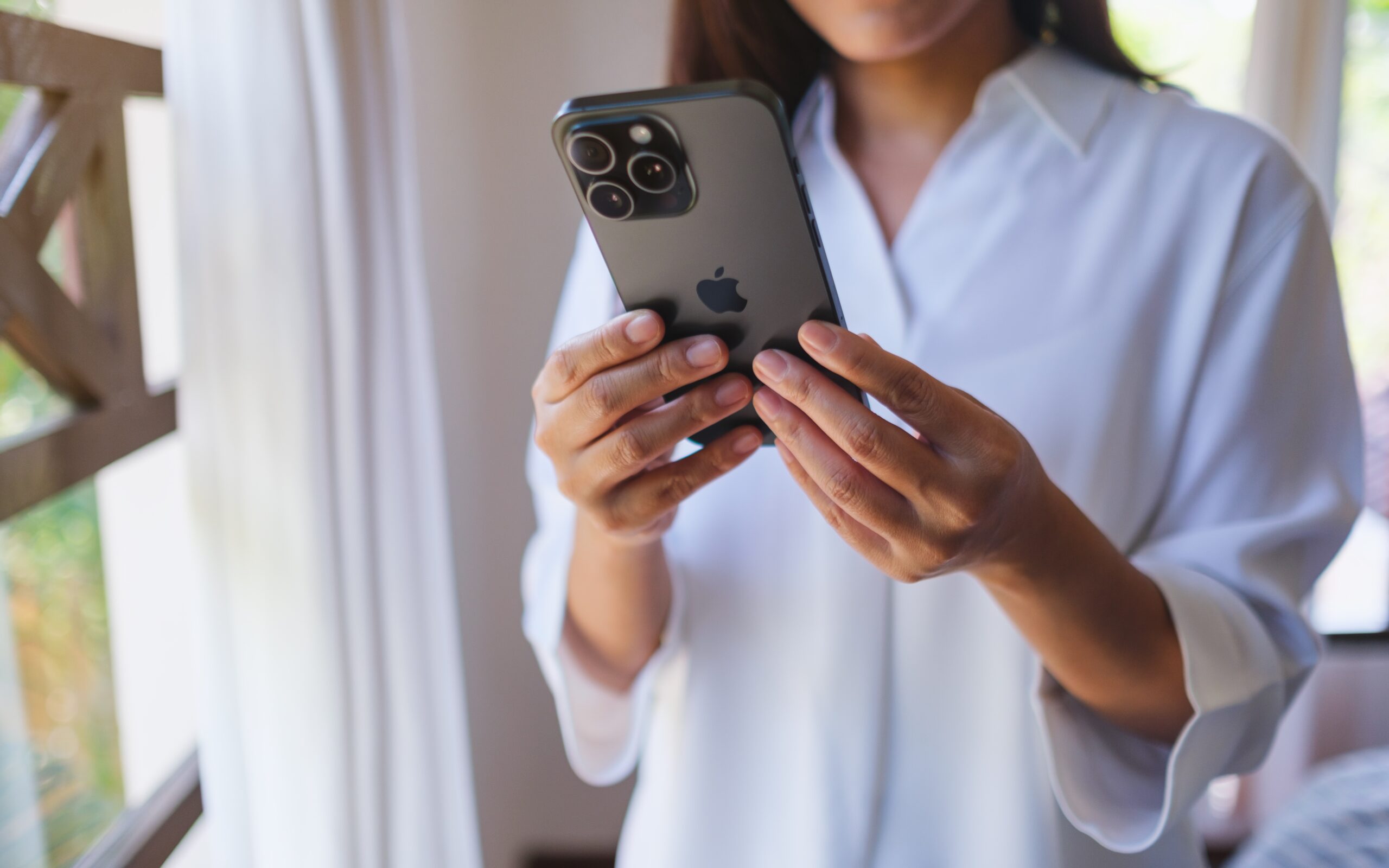 A woman silencing her phone.